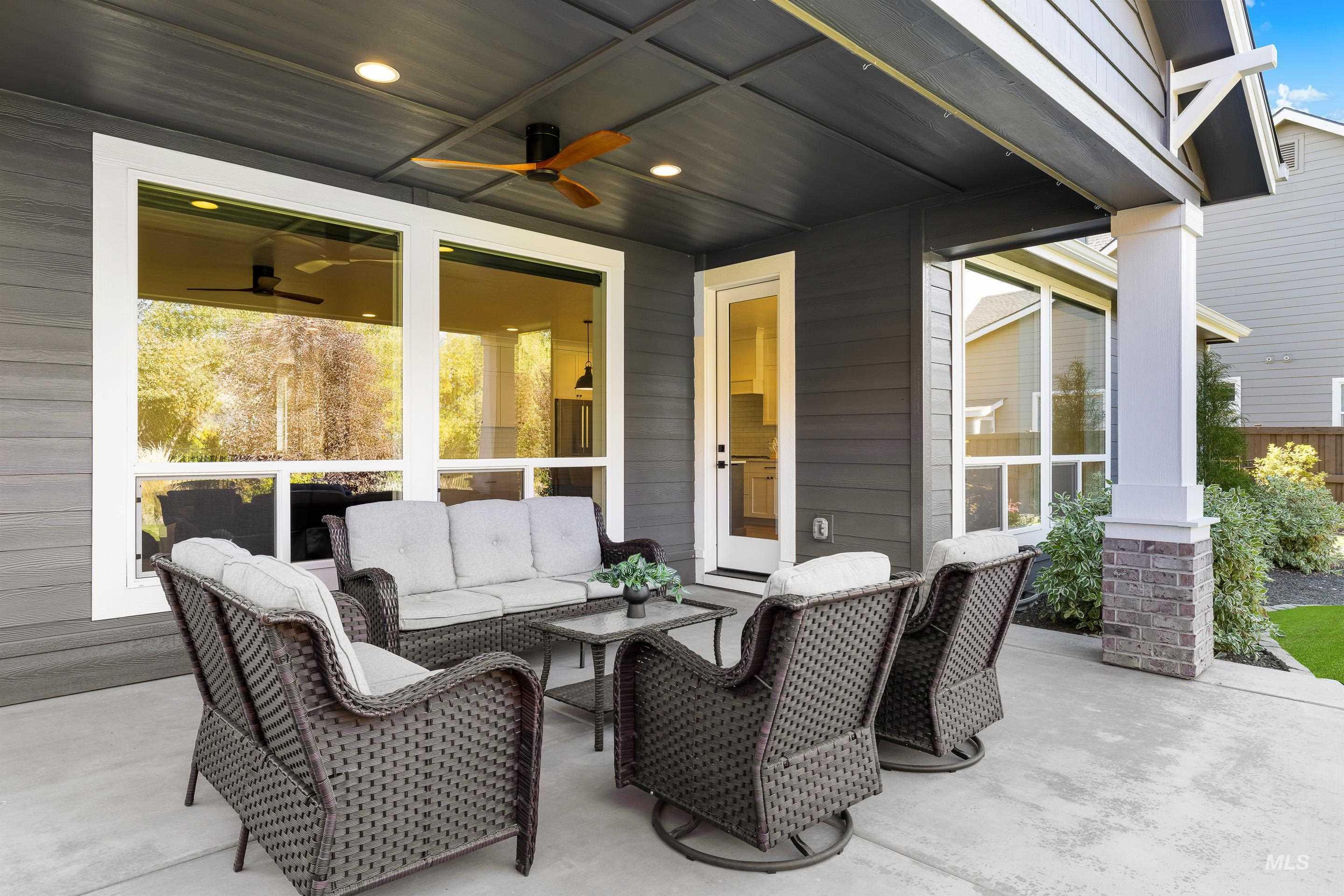 View of patio featuring outdoor lounge area and a ceiling fan