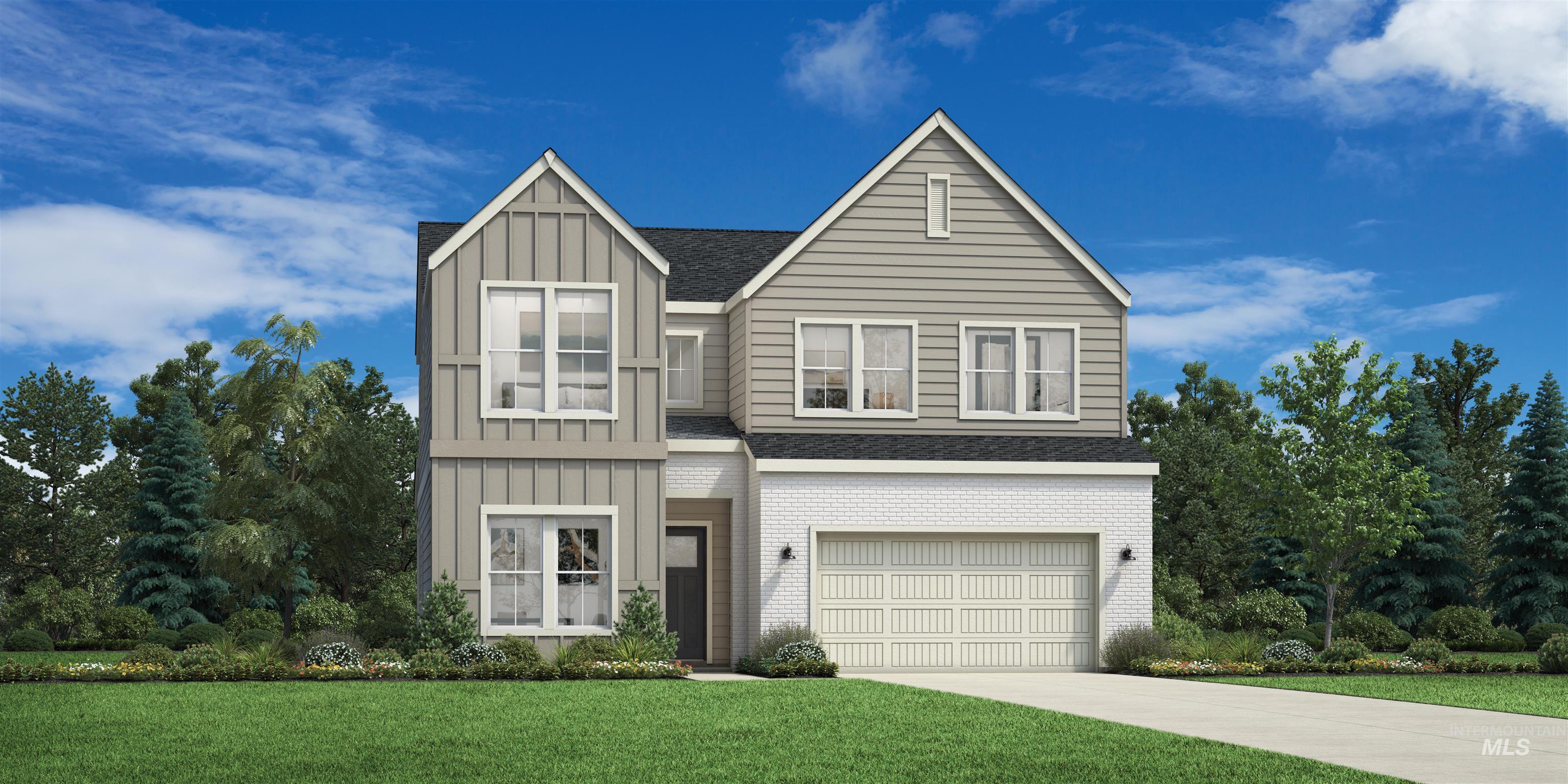 View of front of home with board and batten siding, a front yard, and an attached garage