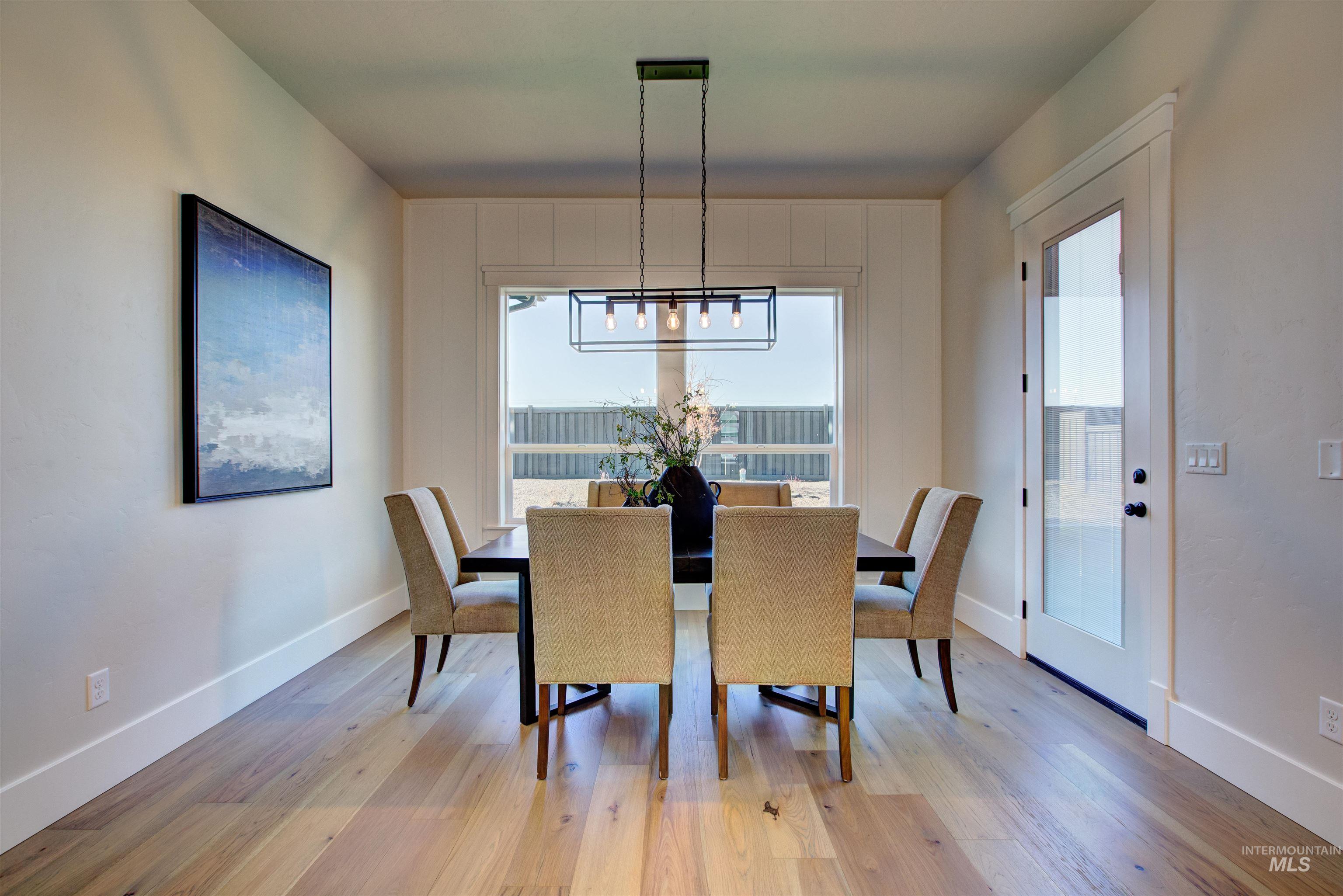 Dining room with light wood-style flooring