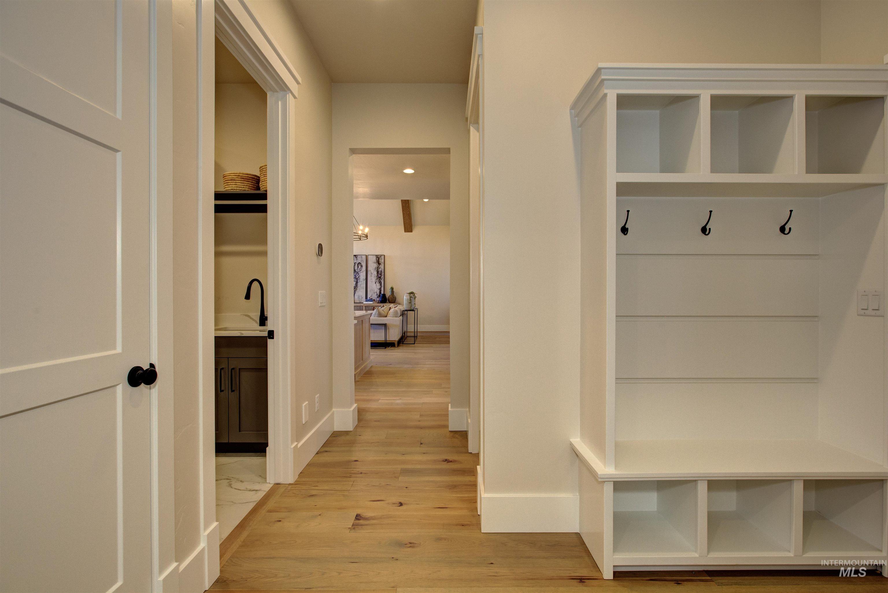 Mudroom with light wood-style floors and recessed lighting