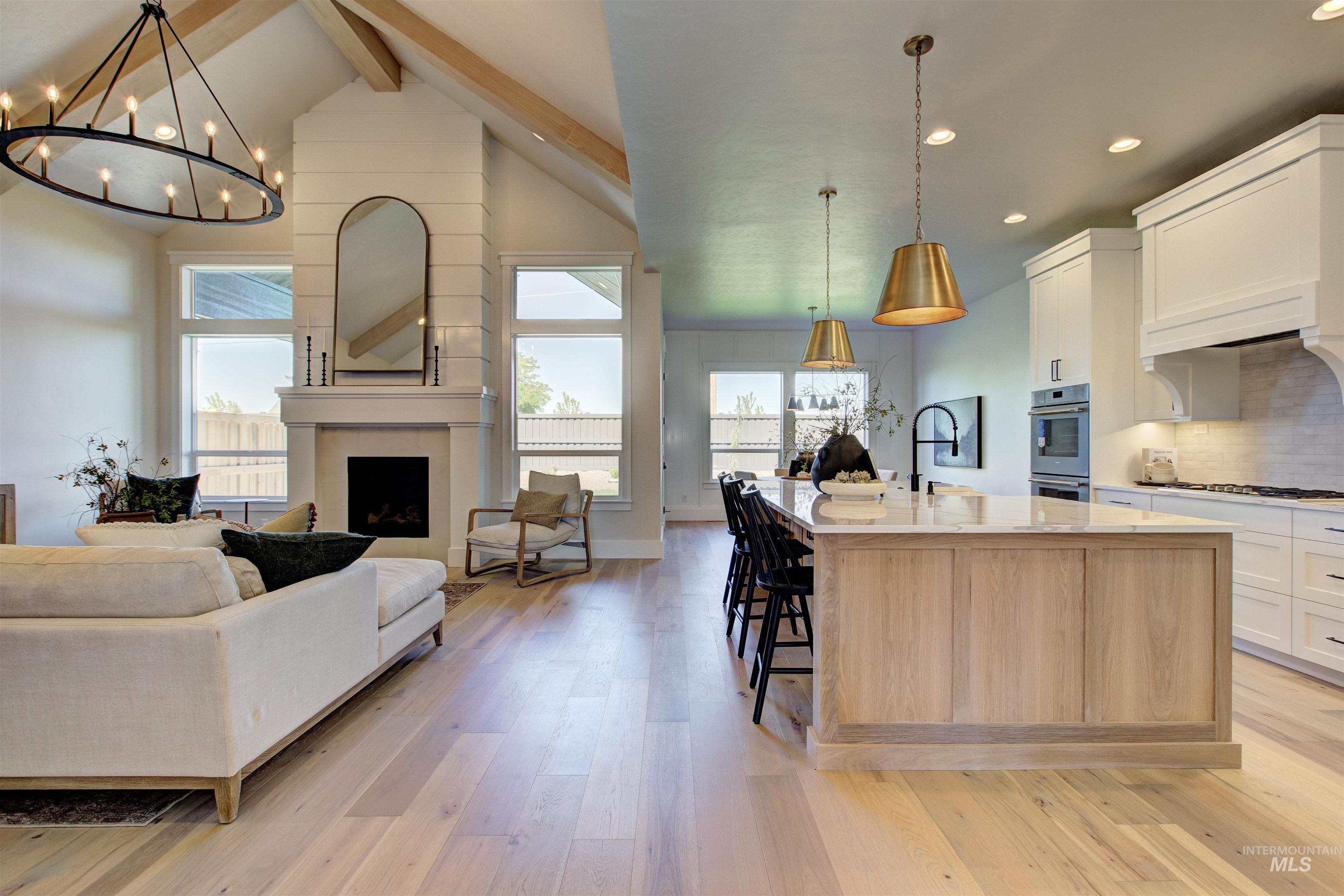 Kitchen with open floor plan, healthy amount of natural light, light wood-style flooring, and recessed lighting