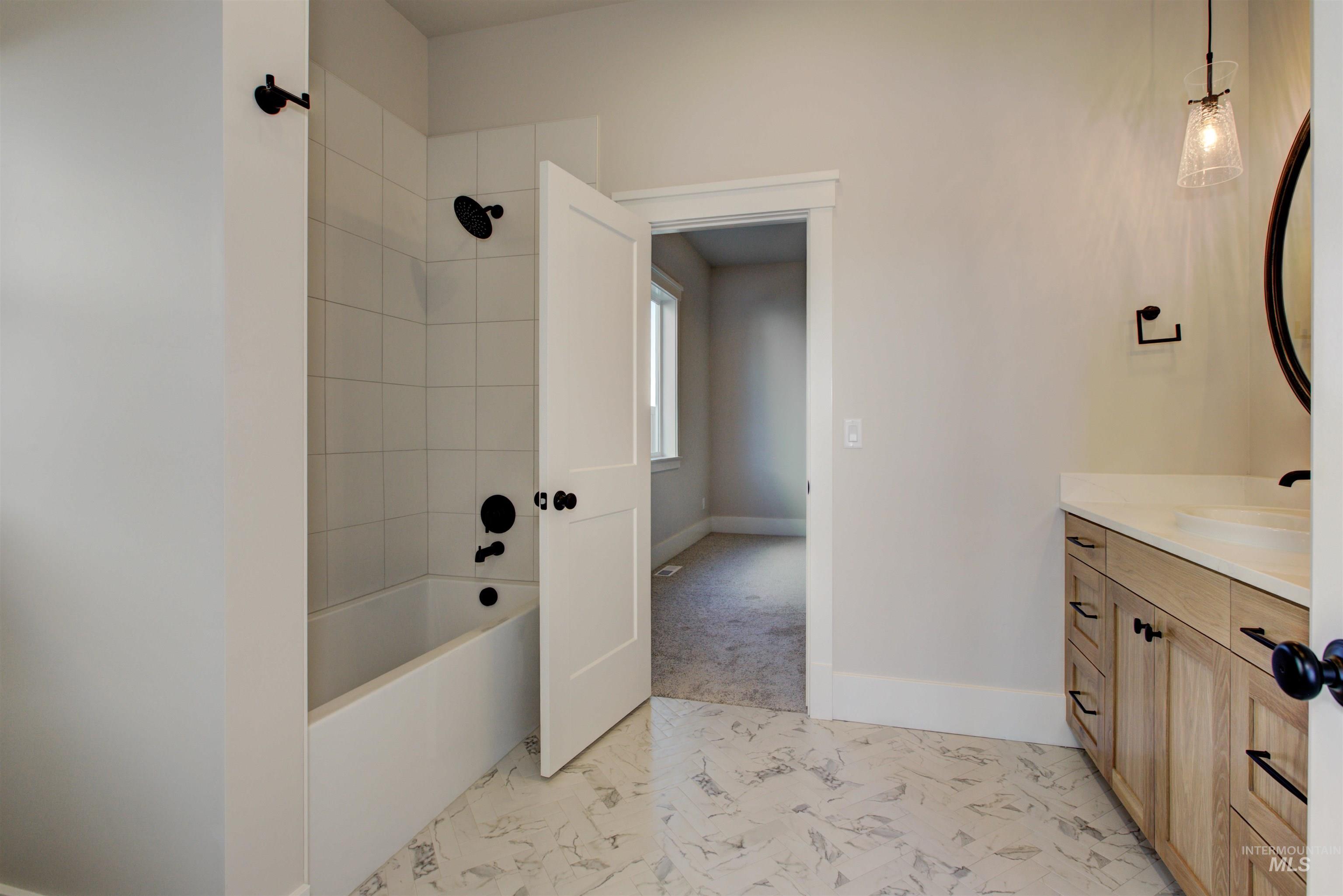 Full bathroom featuring vanity and bathtub / shower combination