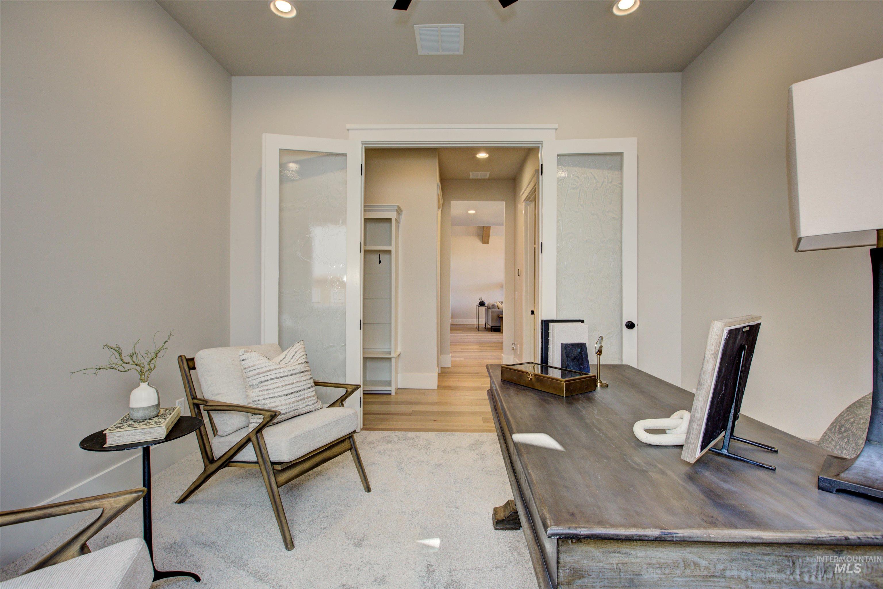 Office space featuring recessed lighting, light wood finished floors, and ceiling fan