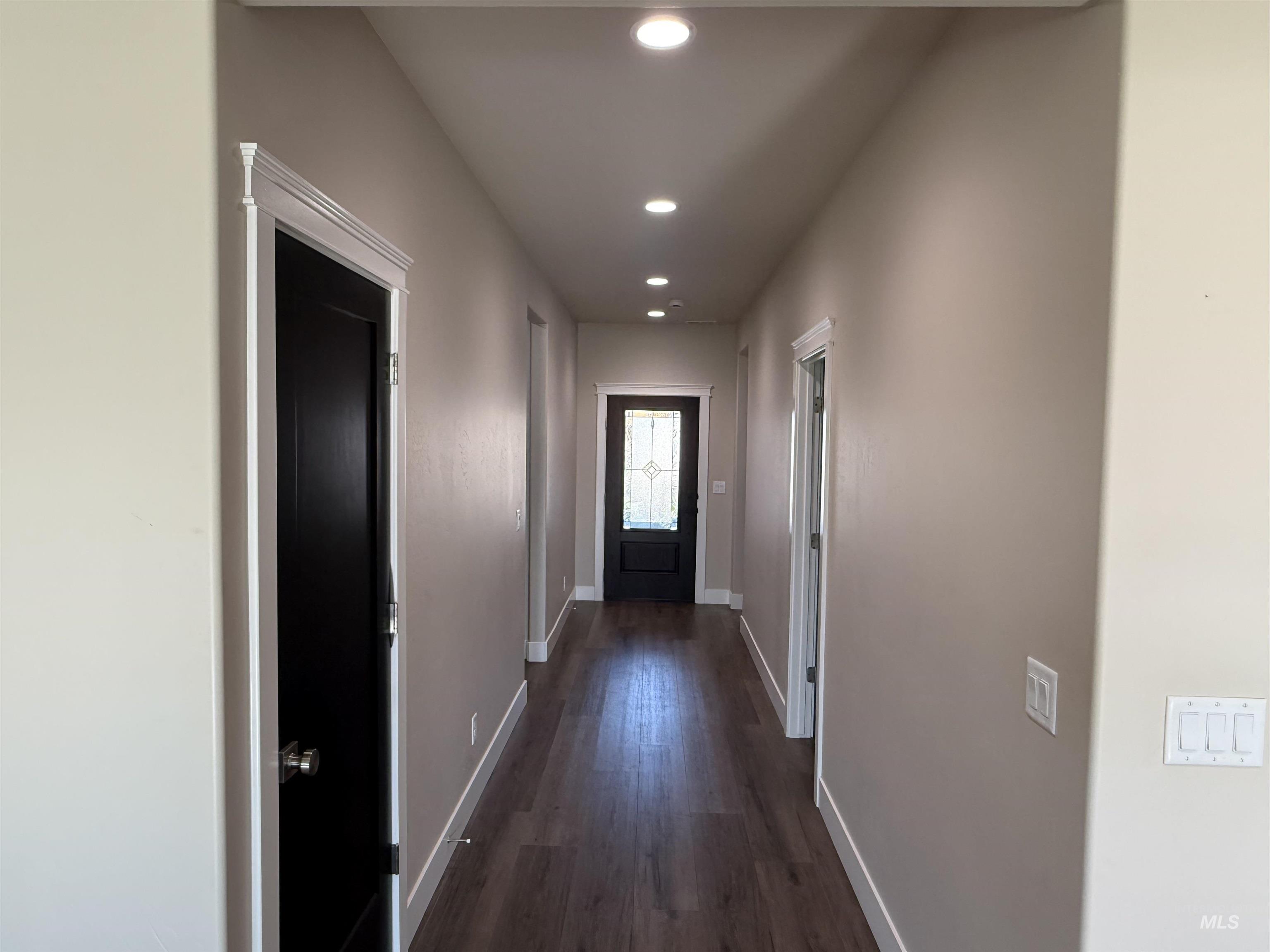 Doorway featuring recessed lighting and wood finished floors
