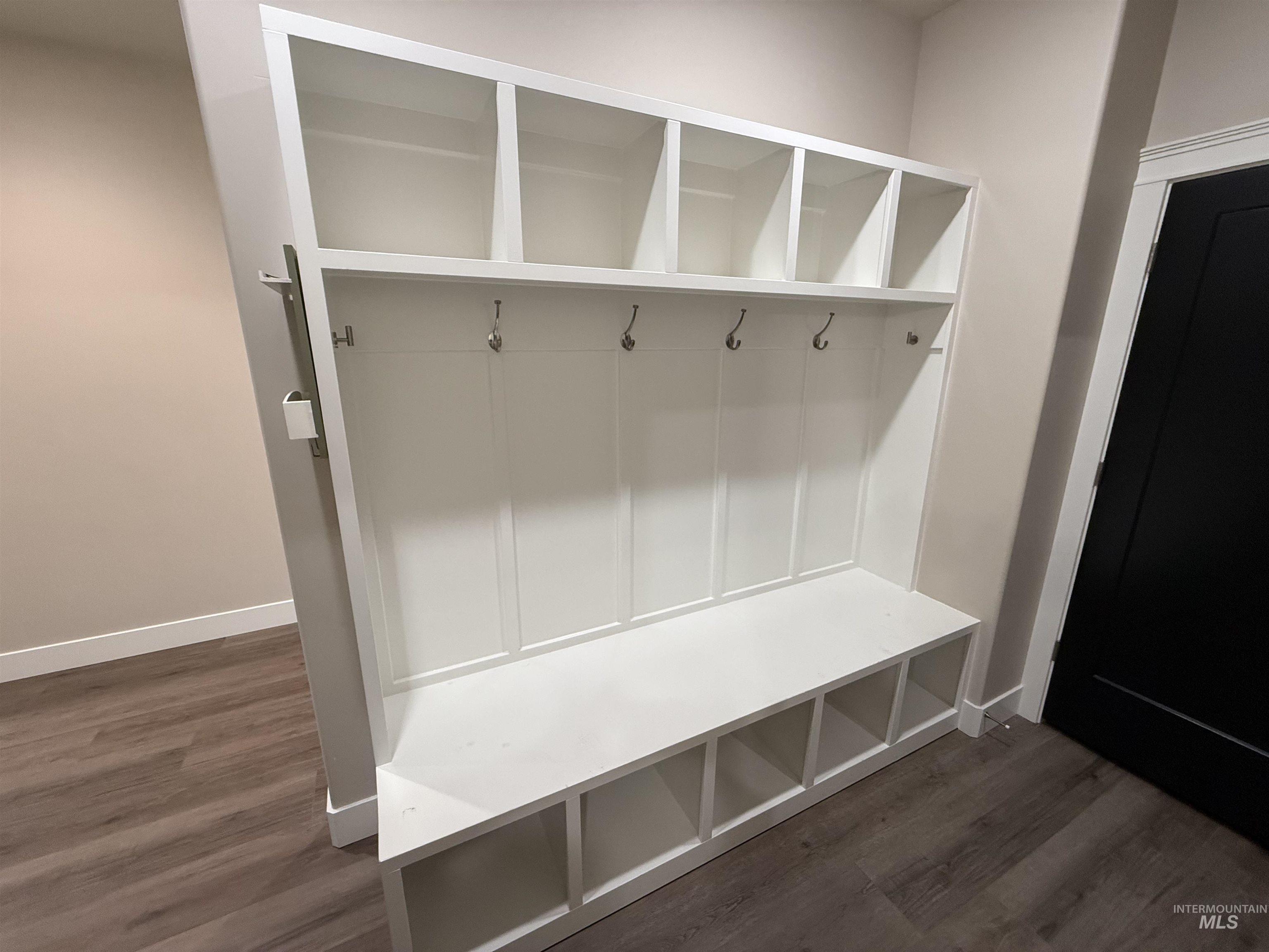 Mudroom with dark wood-style floors