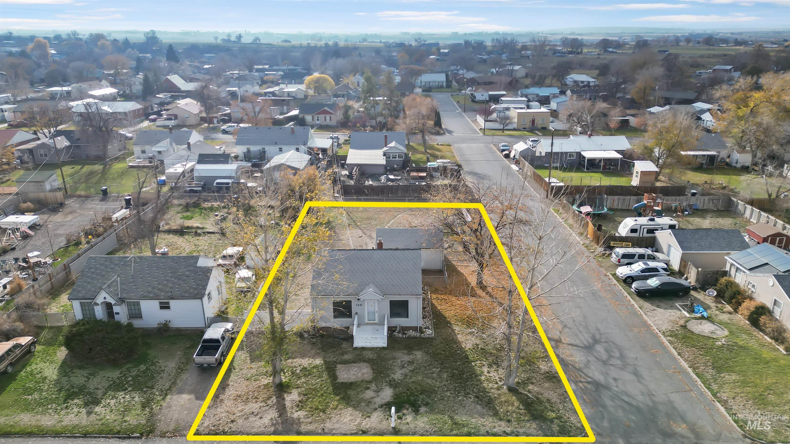 Aerial perspective of suburban area featuring property boundaries highlighted