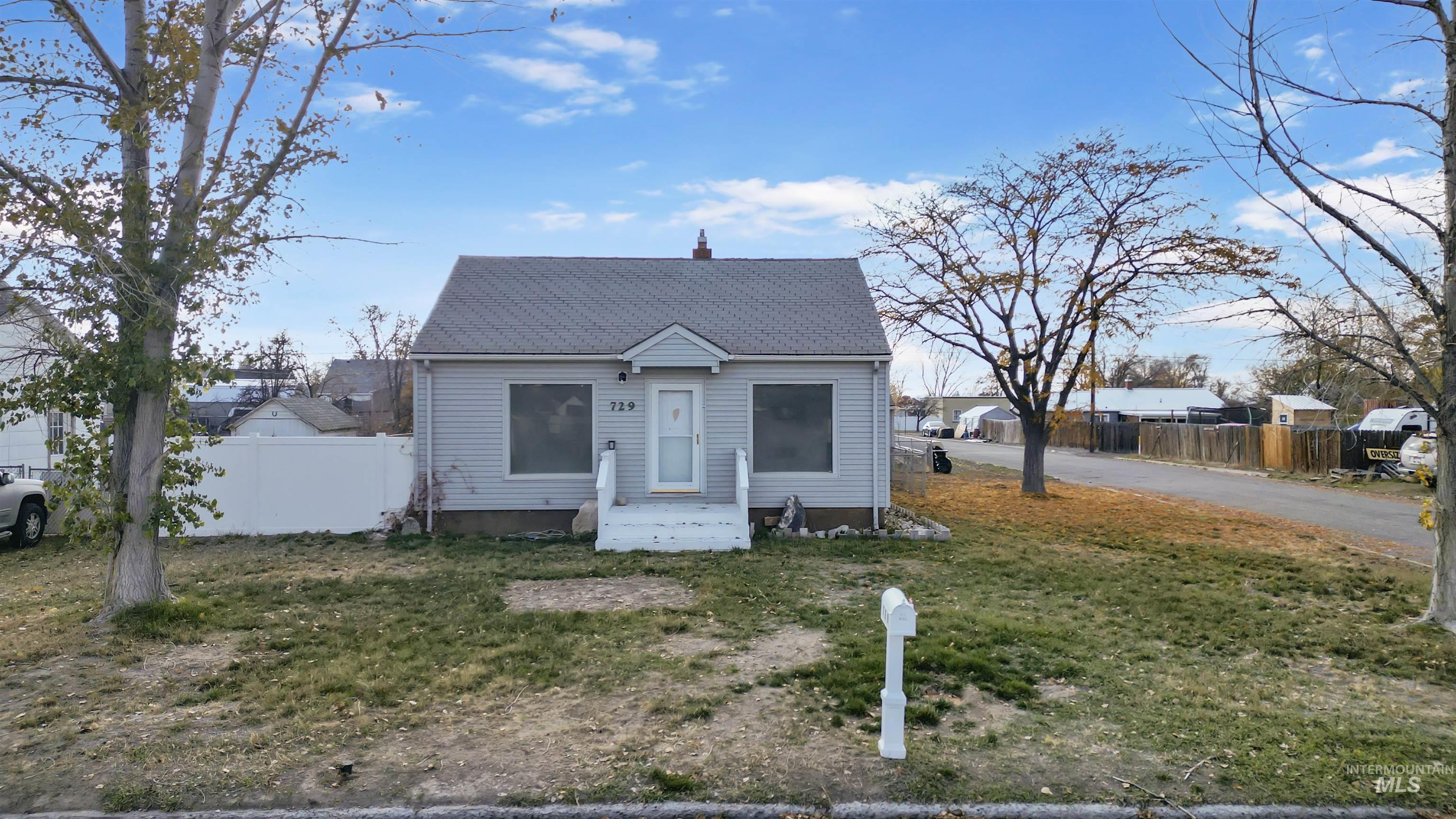 Bungalow-style home with a chimney