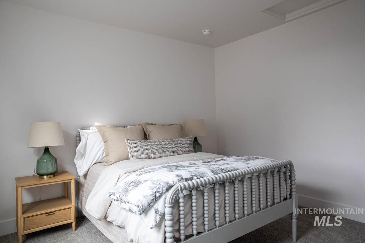 Bedroom with carpet and baseboards