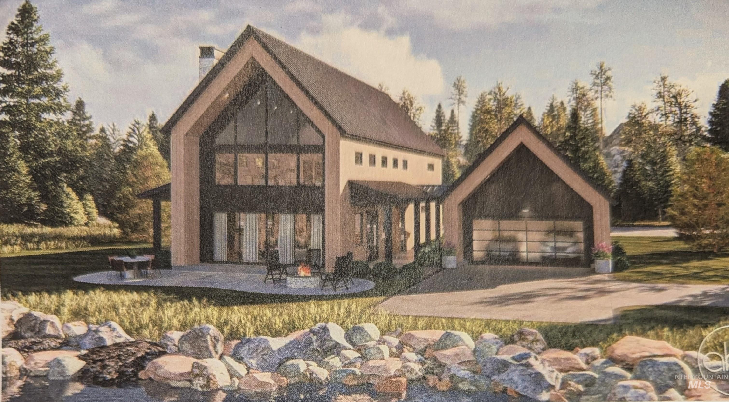 front view of property featuring a patio, a chimney, a fire pit, and a garage