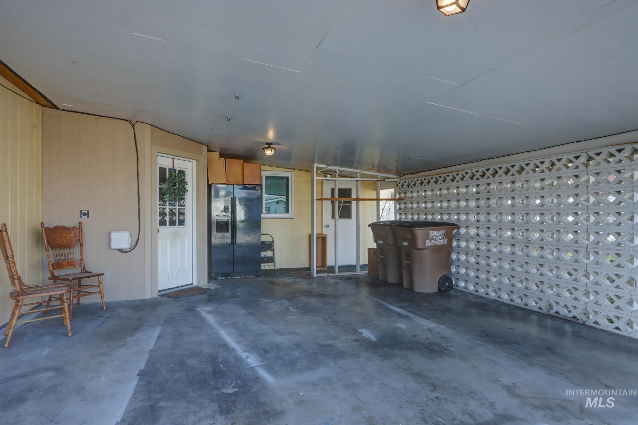 Garage featuring black fridge