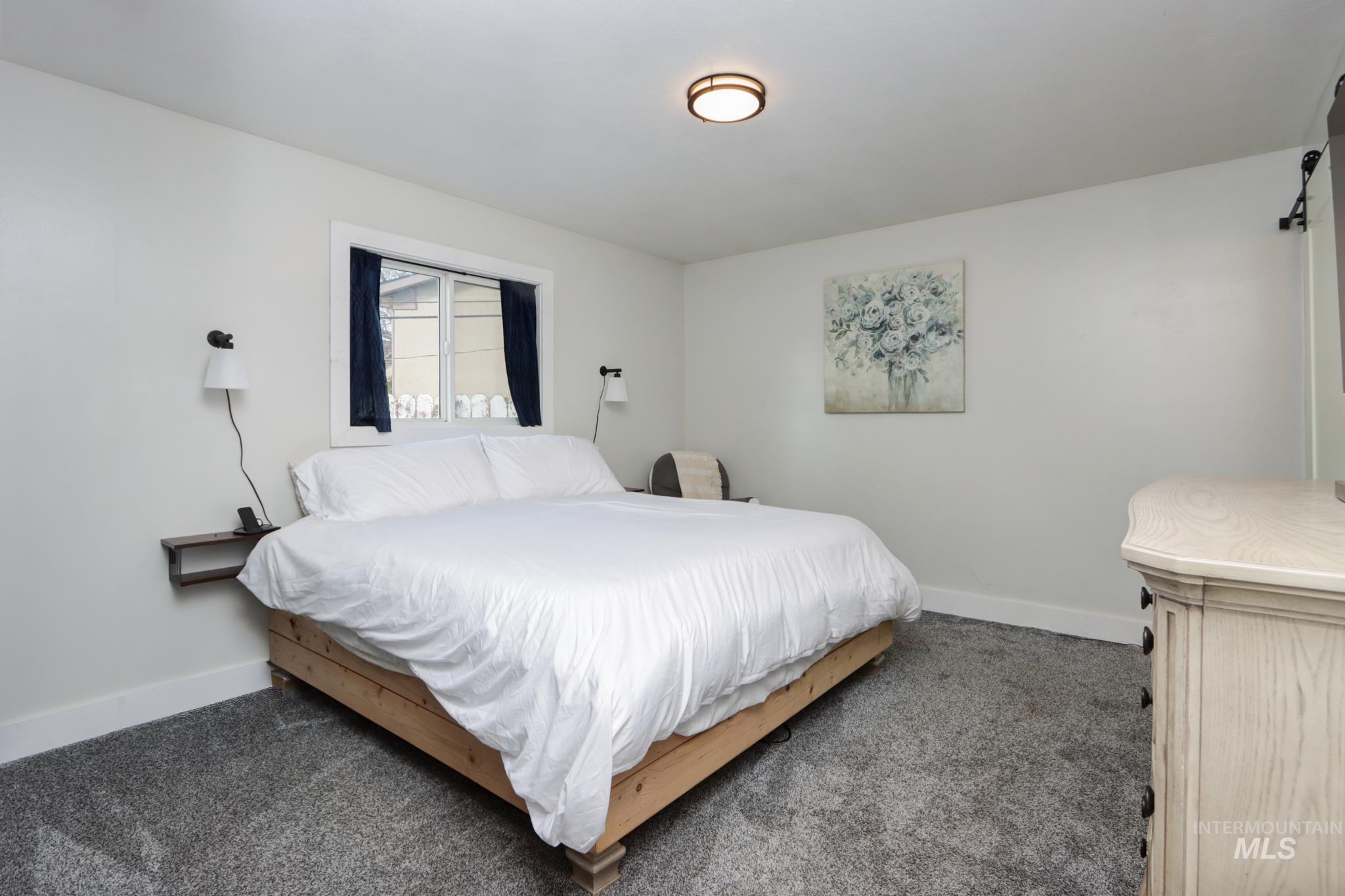 Bedroom with carpet and baseboards