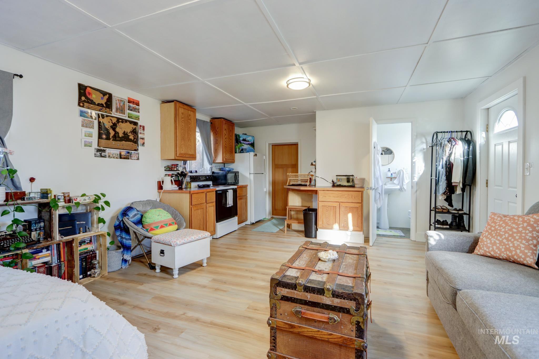 Living area with light wood-type flooring