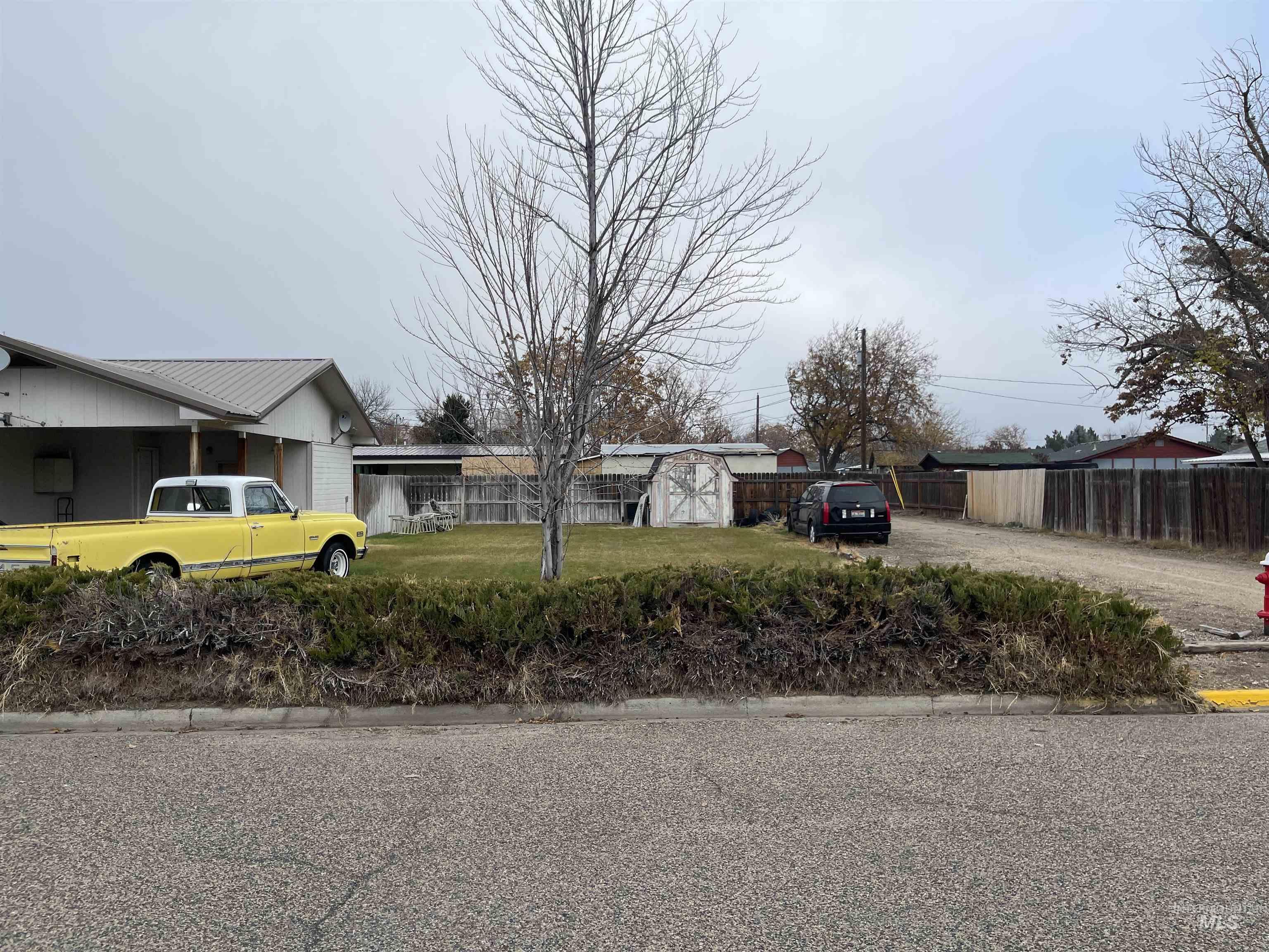 View of asphalt road with curbs
