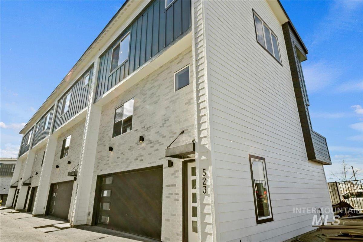 View of property with a garage