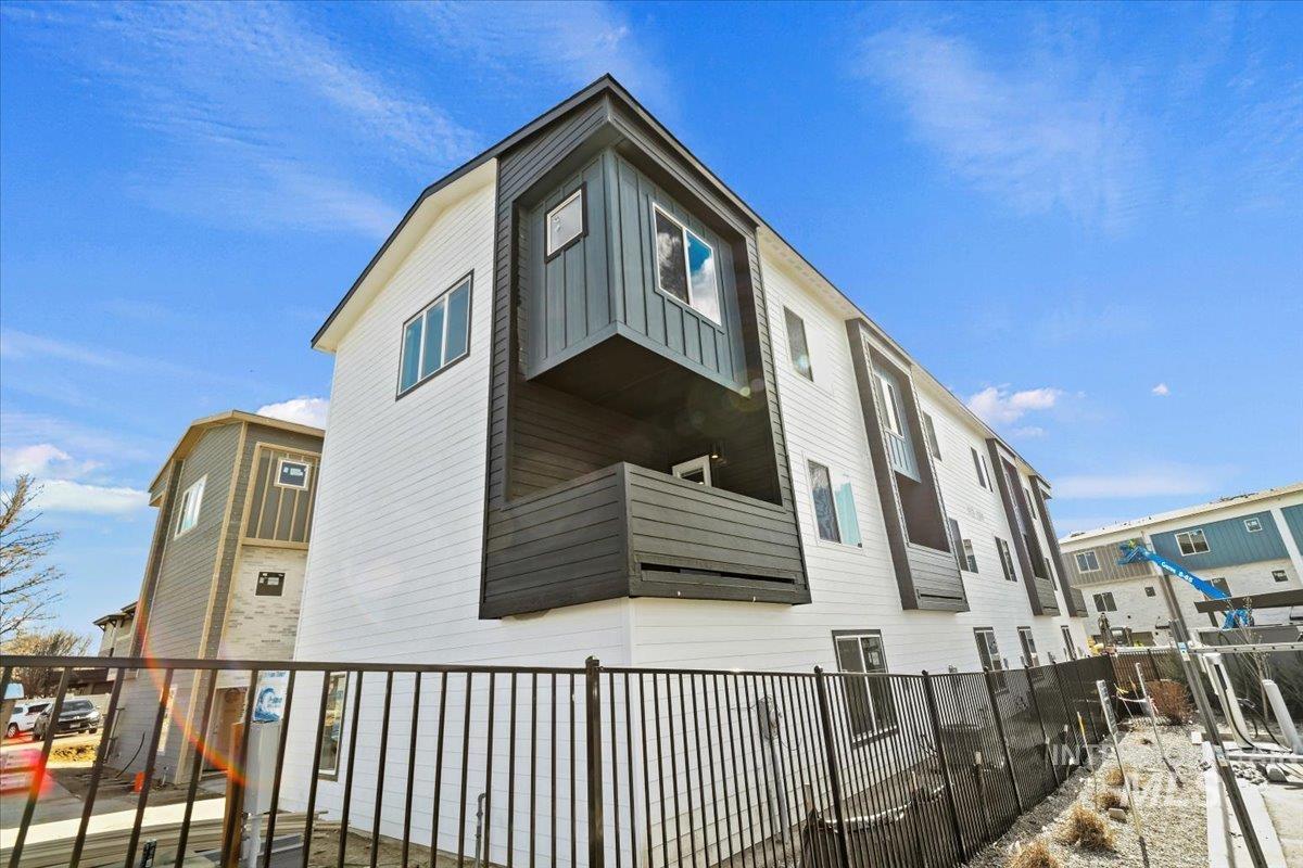 View of side of property featuring a balcony