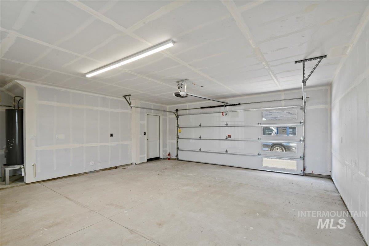 Garage featuring water heater