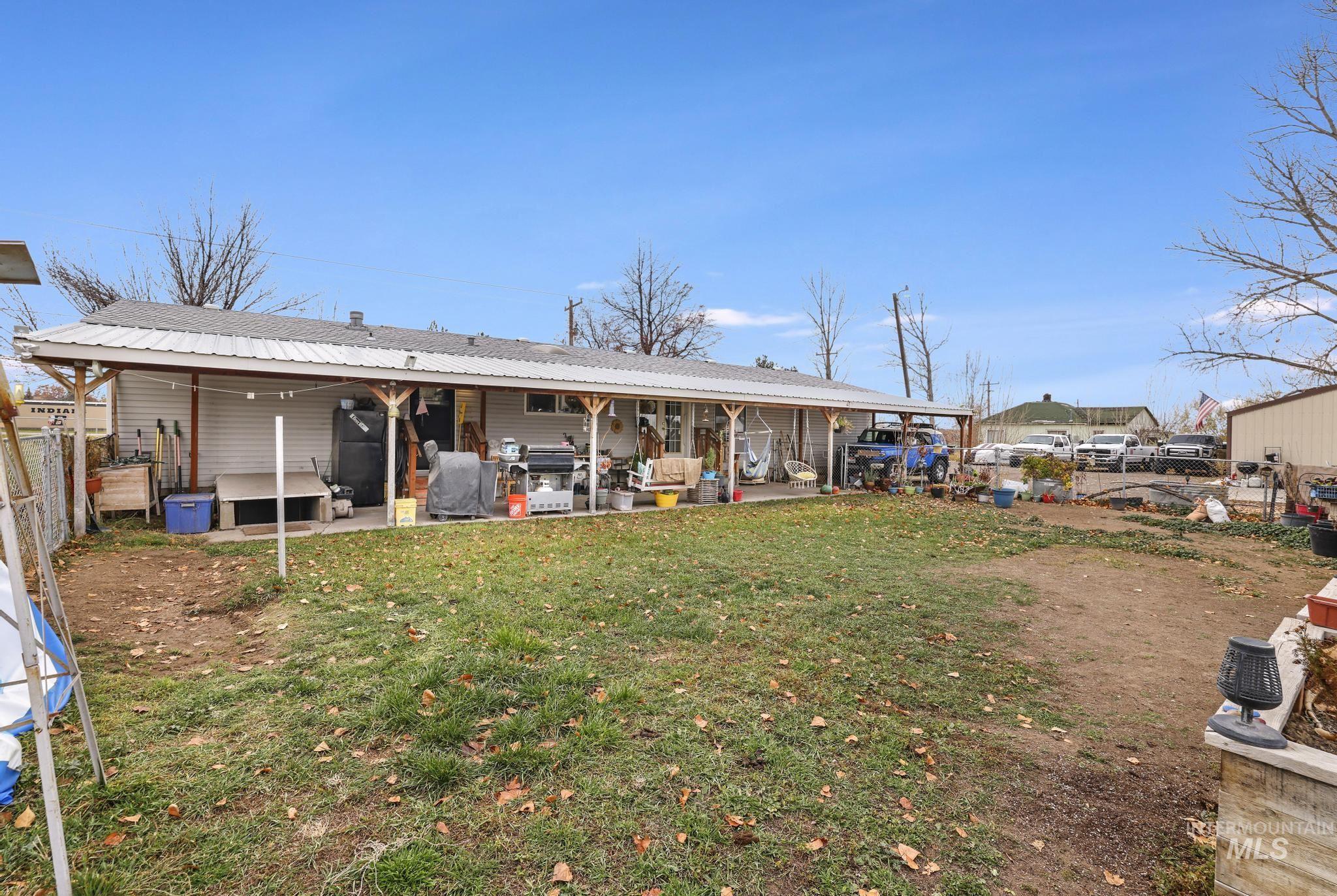 Rear of Home featuring carport