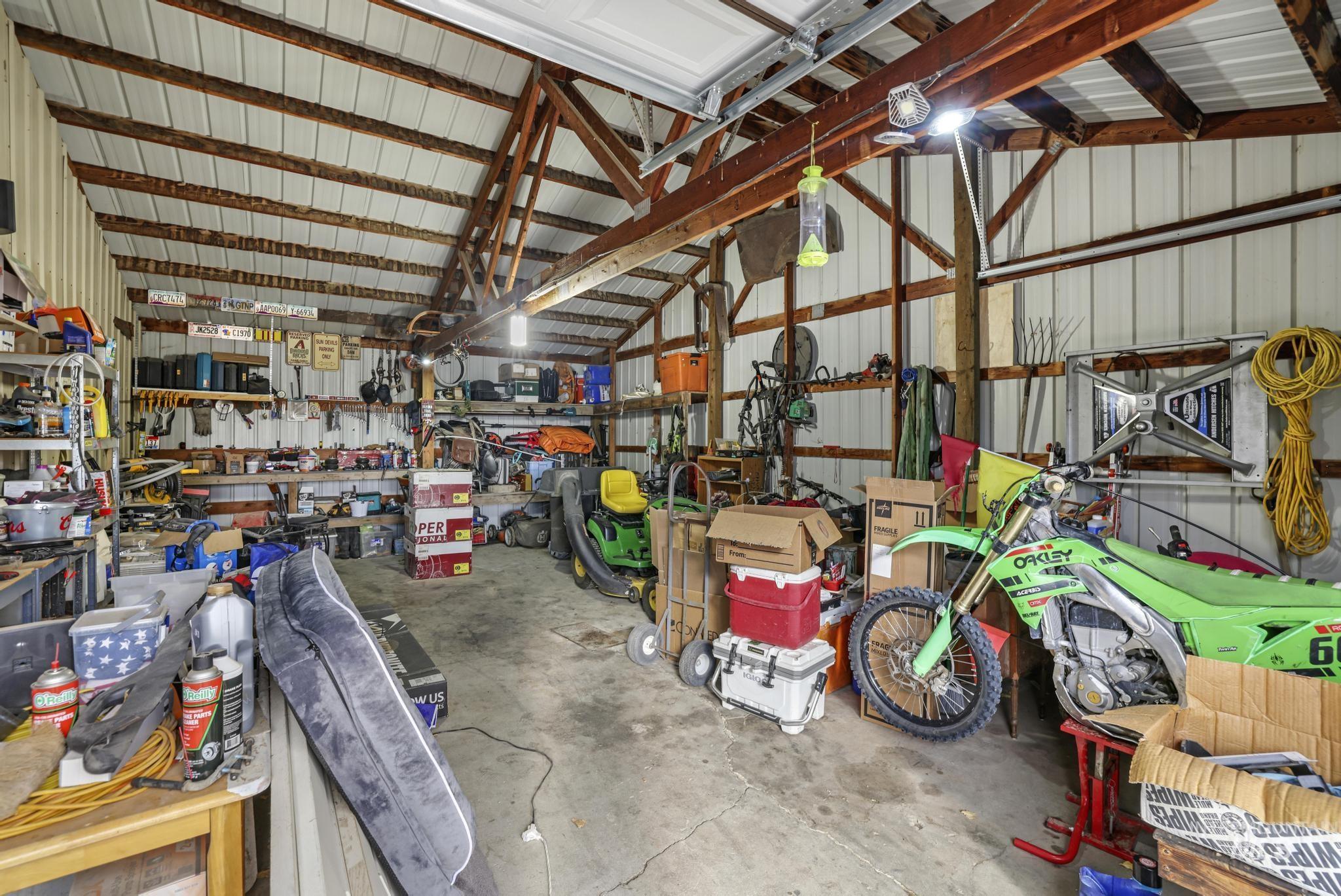 Garage with metal wall and a workshop area