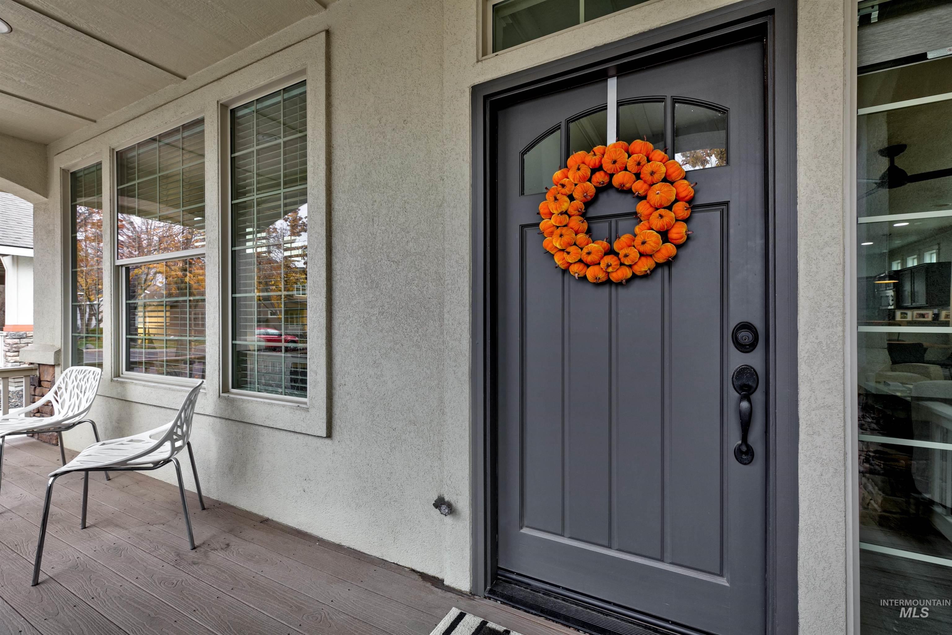 The inviting front porch offers large covered space for relaxing outside and enjoying the neighborhood.