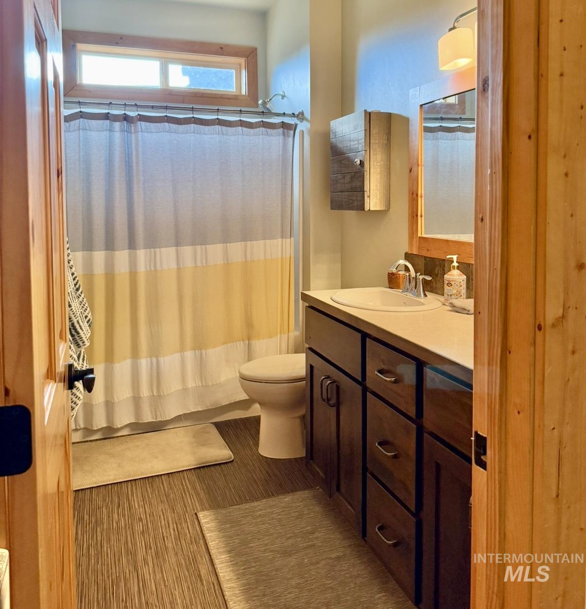 Full bathroom featuring vanity and shower / bath combo