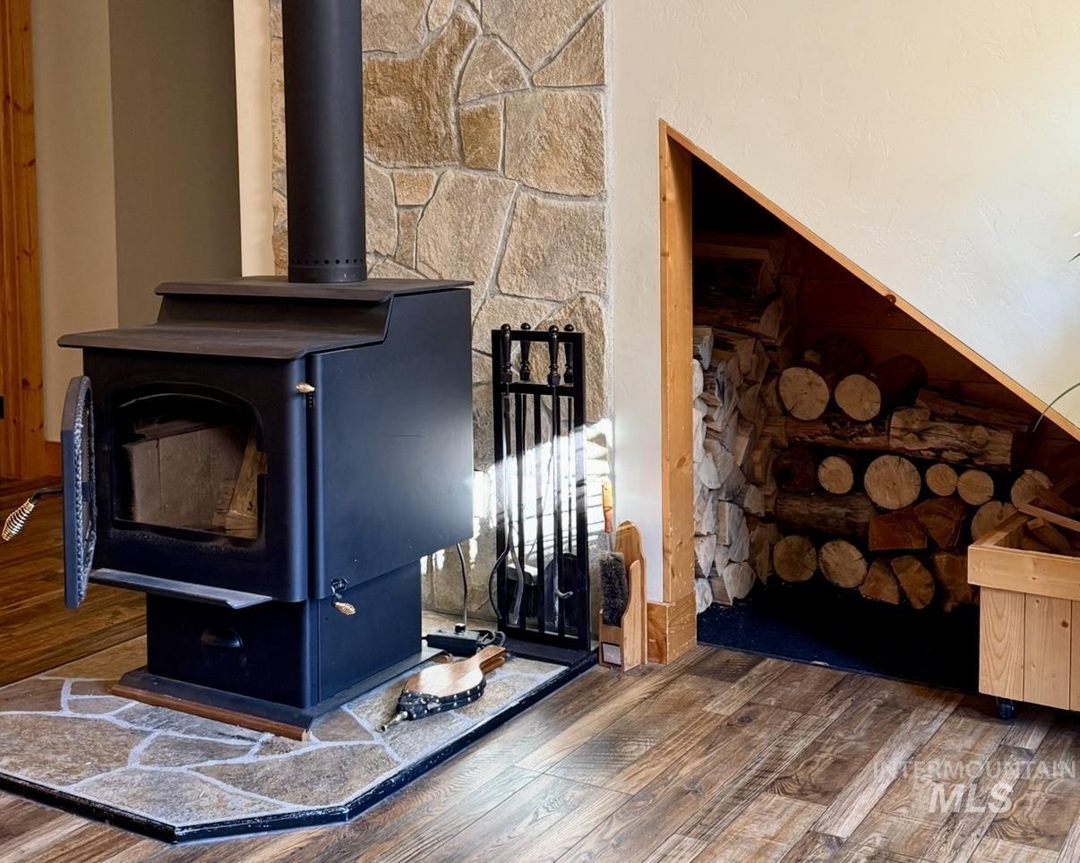 Detailed view of a wood stove and wood finished floors