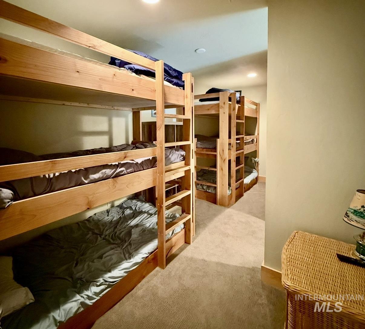 Bedroom featuring light colored carpet and recessed lighting