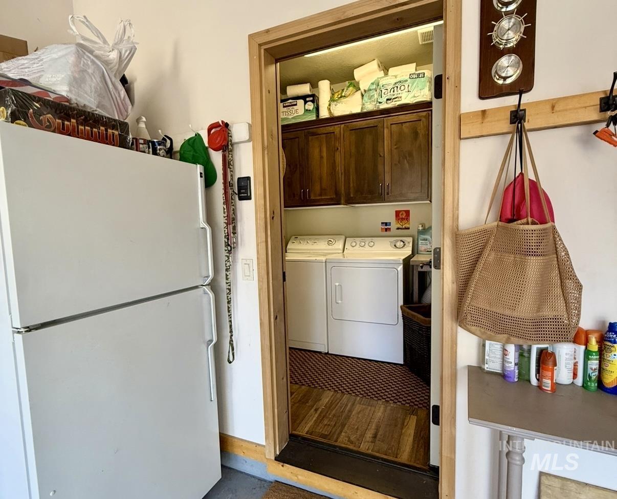 Laundry area with cabinet space and separate washer and dryer