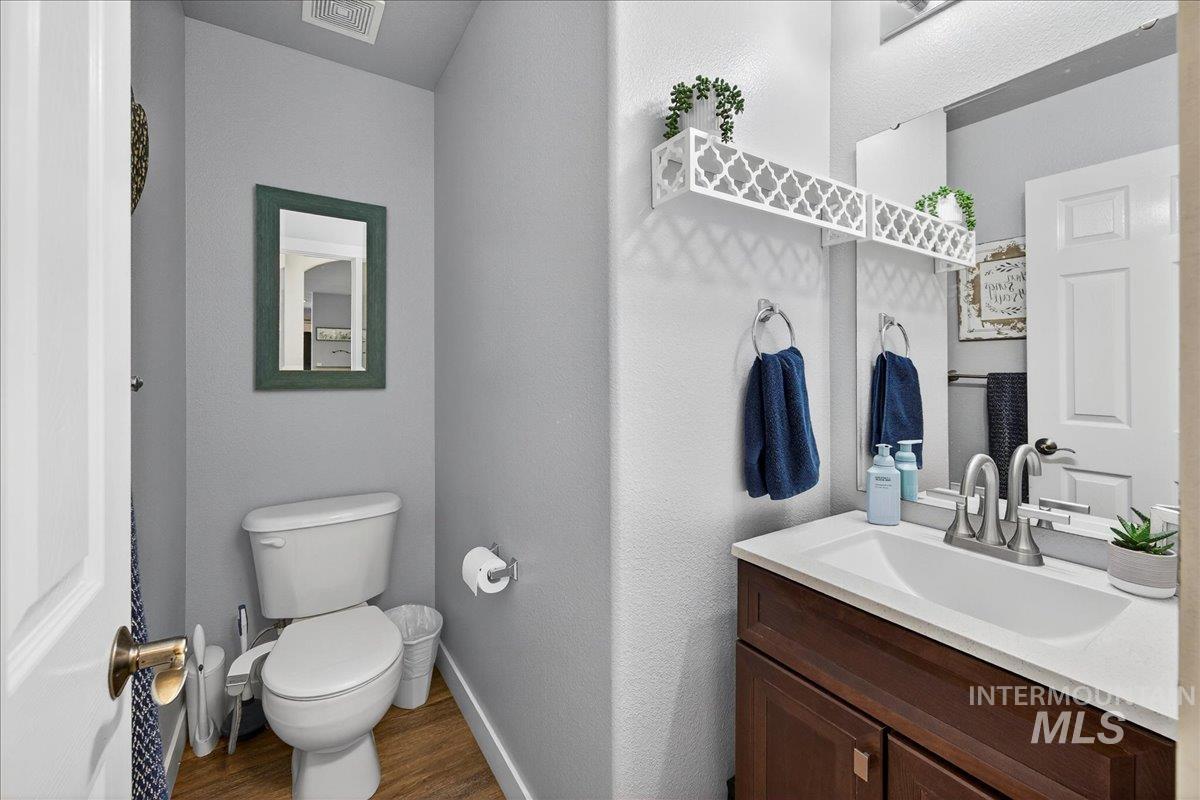 Bathroom with vanity and wood finished floors