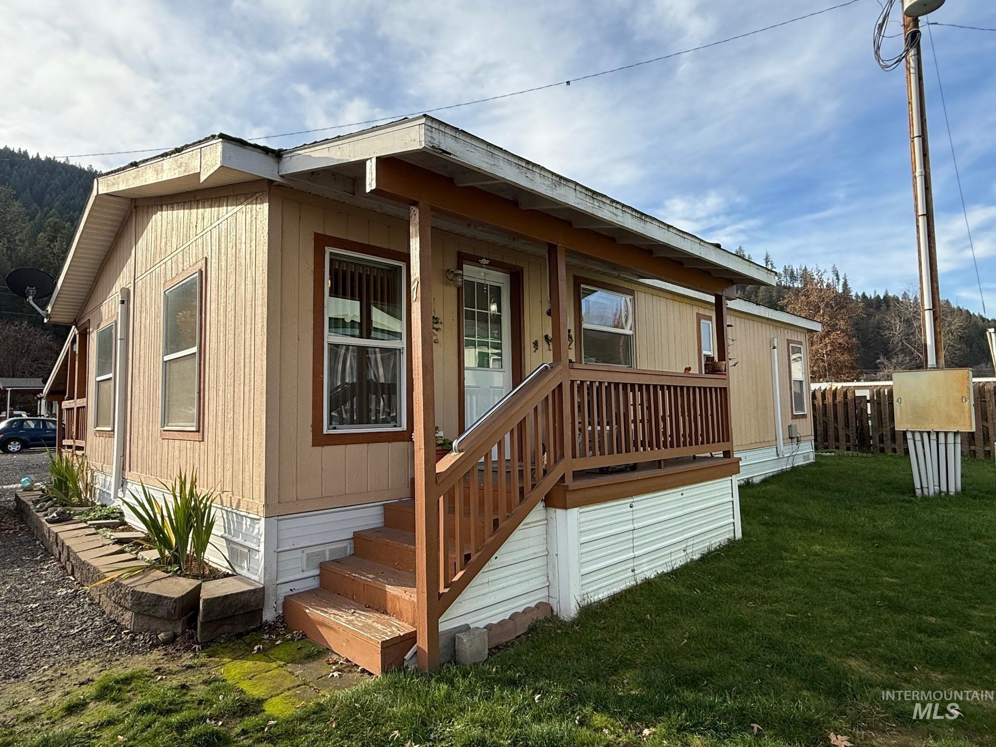 Rear view of house with covered porch