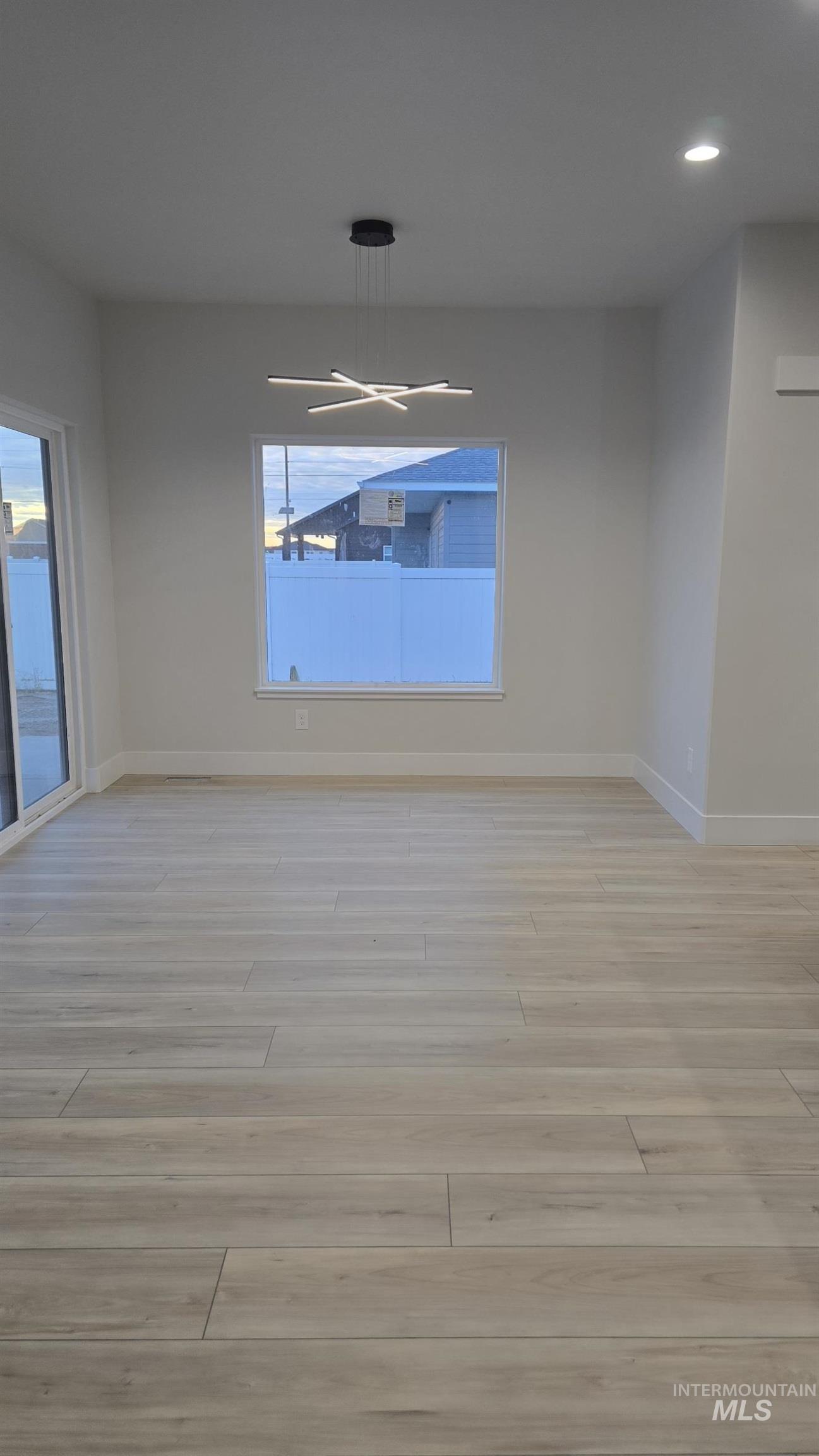 Unfurnished room with recessed lighting and light wood-style flooring