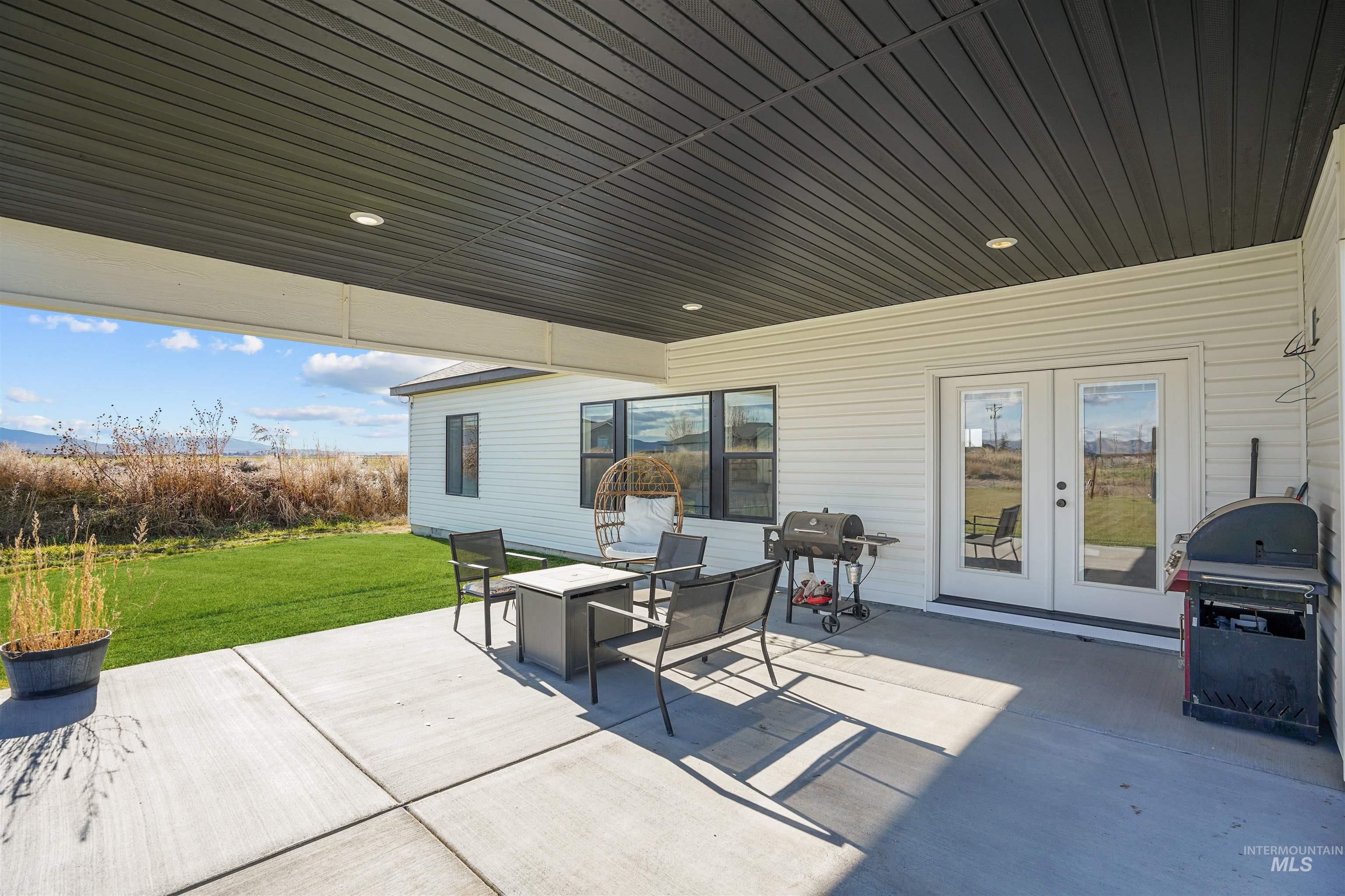 View of patio featuring a grill and french doors