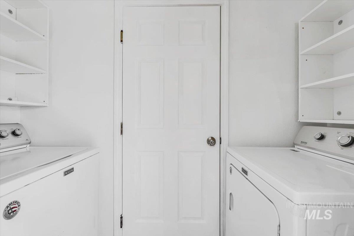 Washroom with washing machine and dryer