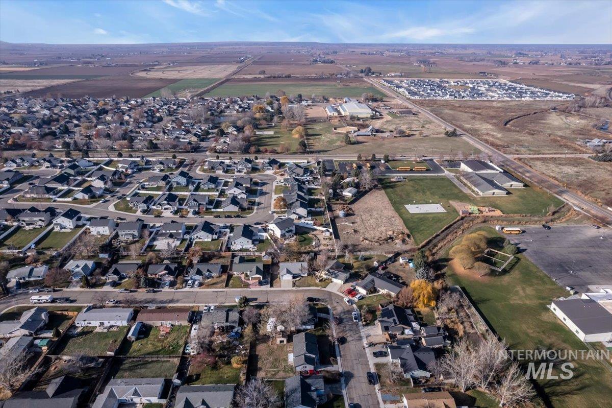 View of property location with nearby suburban area