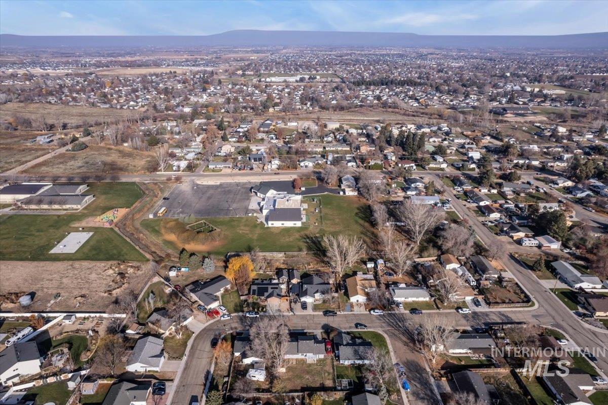 View of property location with nearby suburban area