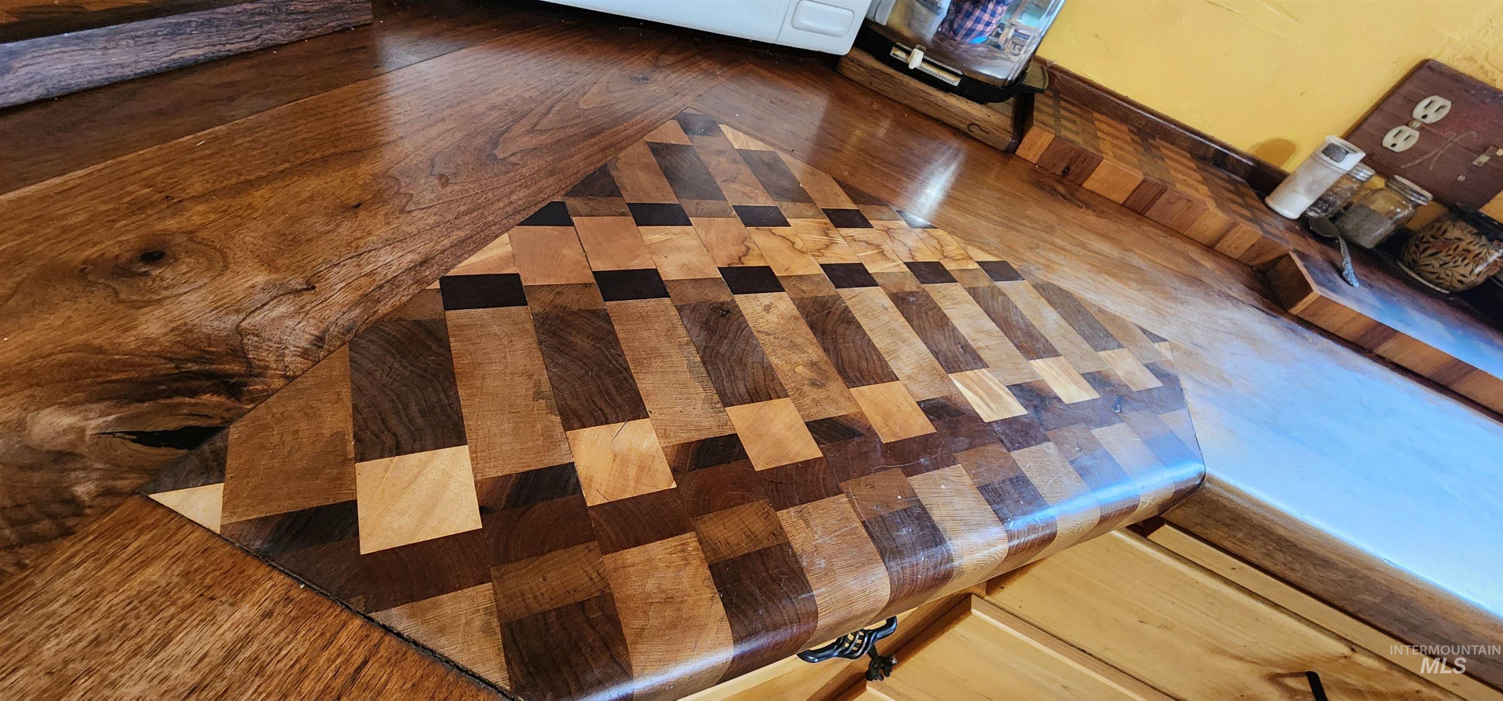 Kitchen view of wood finished floors