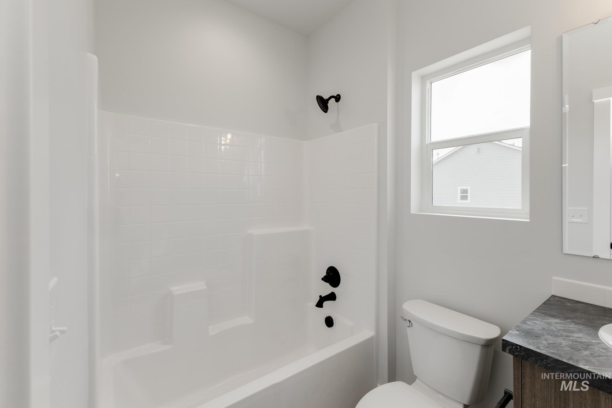 Full bath with vanity and shower / bath combination