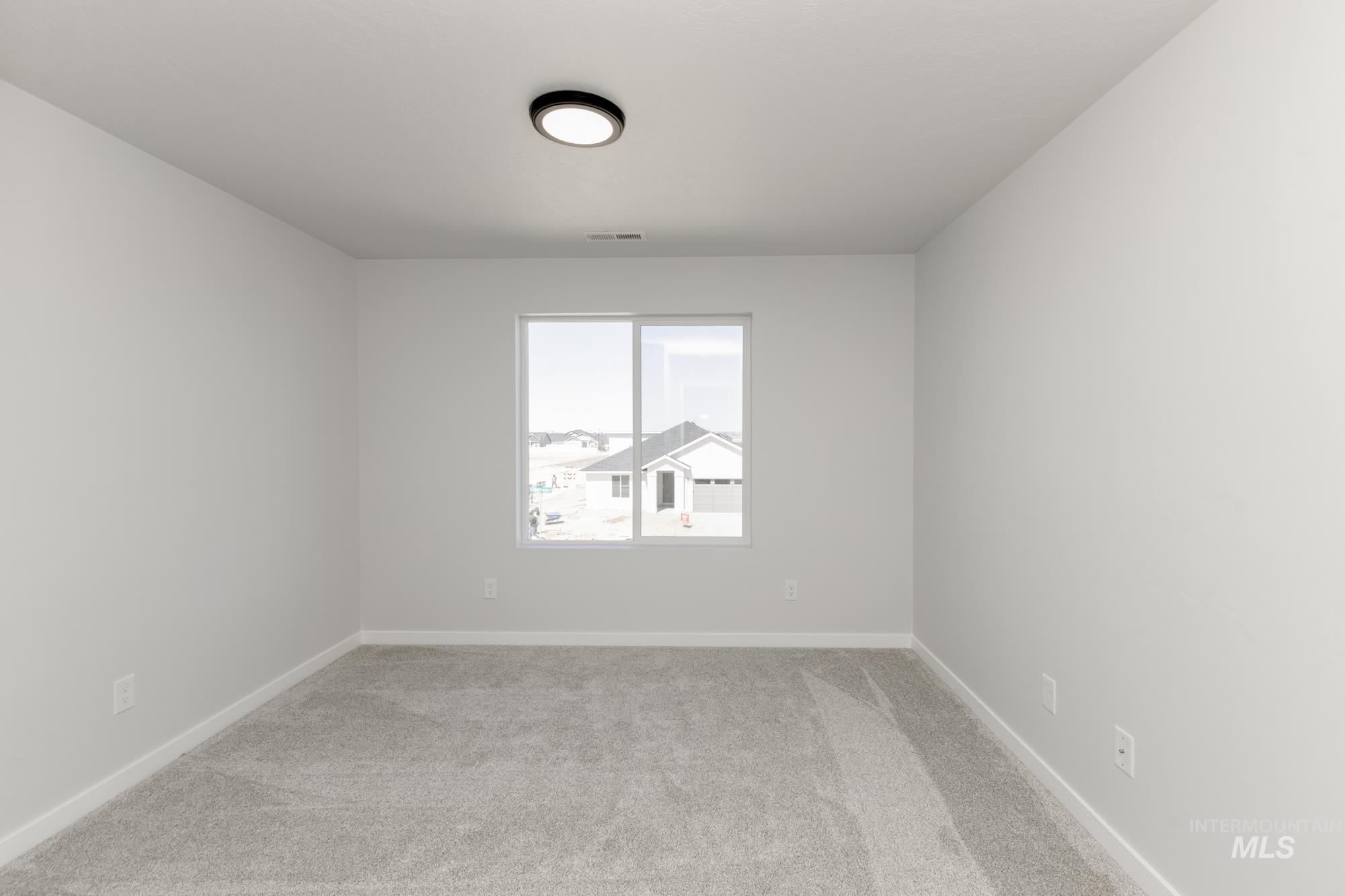 Spare room featuring carpet floors