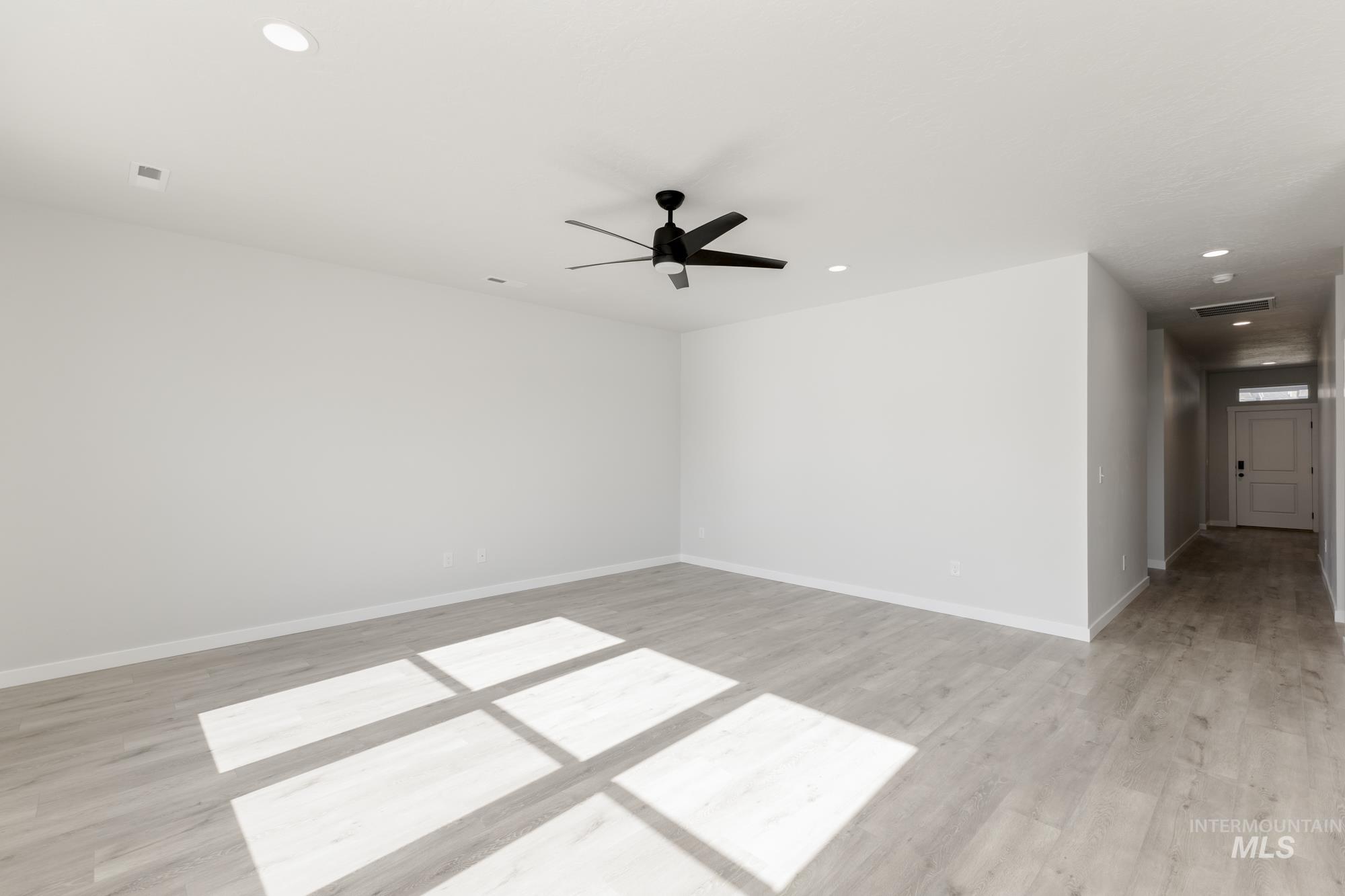 Unfurnished room with recessed lighting, light wood-style floors, and ceiling fan