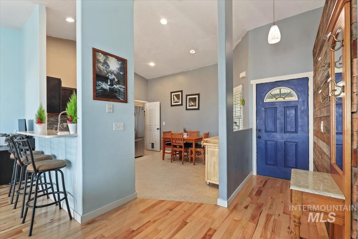 Foyer featuring light wood-style flooring and recessed lighting