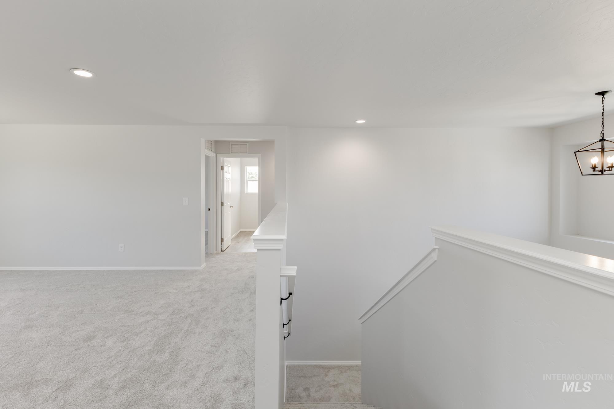 Staircase with recessed lighting and carpet flooring