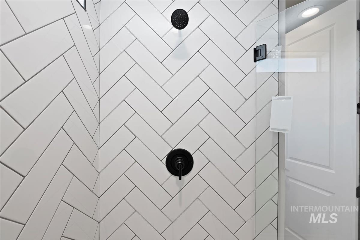 Bathroom view of a tile shower