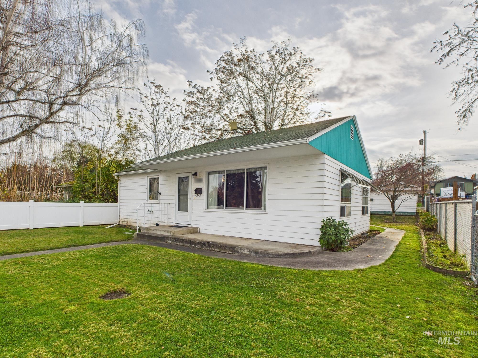 View of front of house featuring roof with shingles