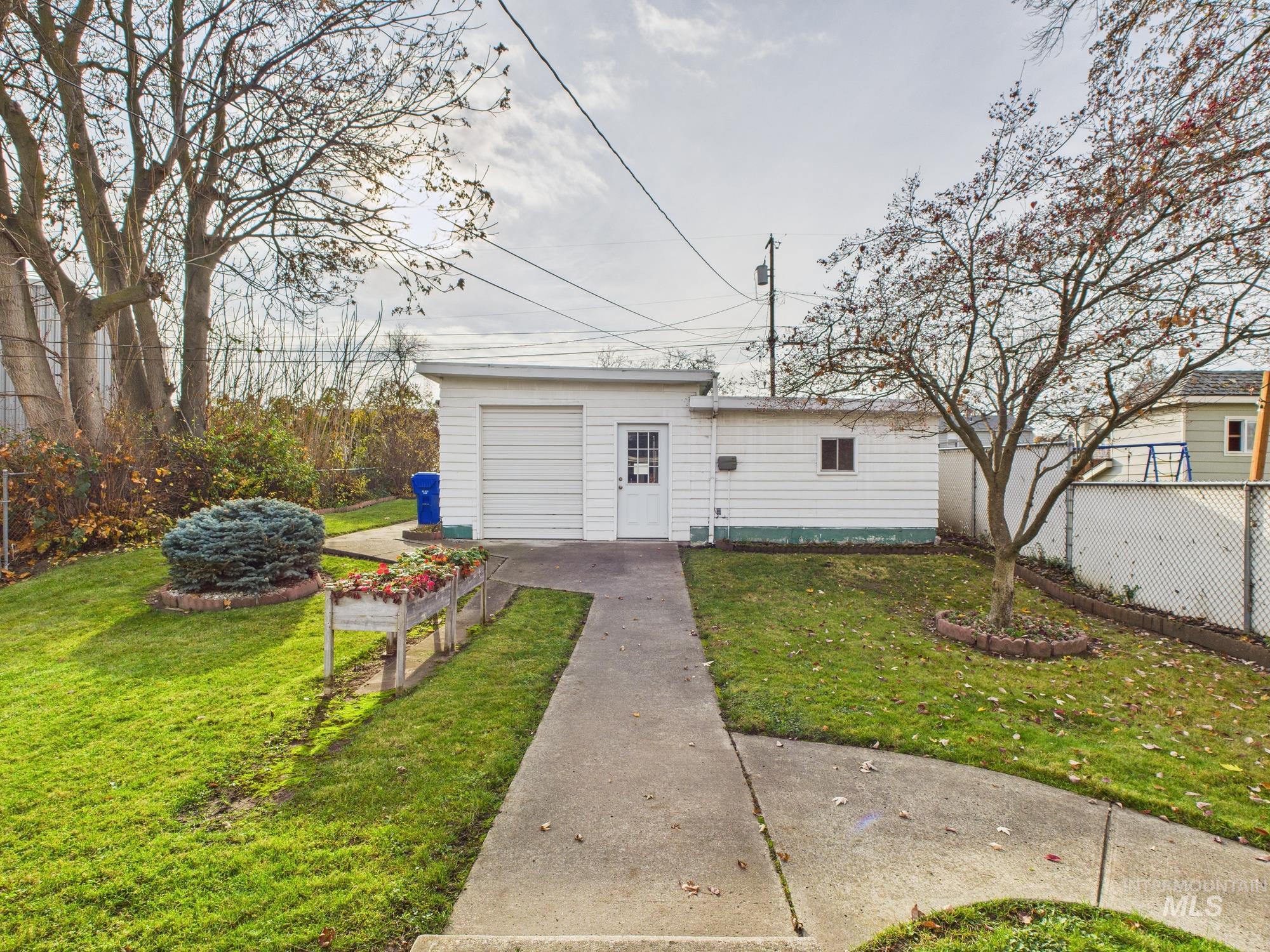 View of front of property with an outbuilding