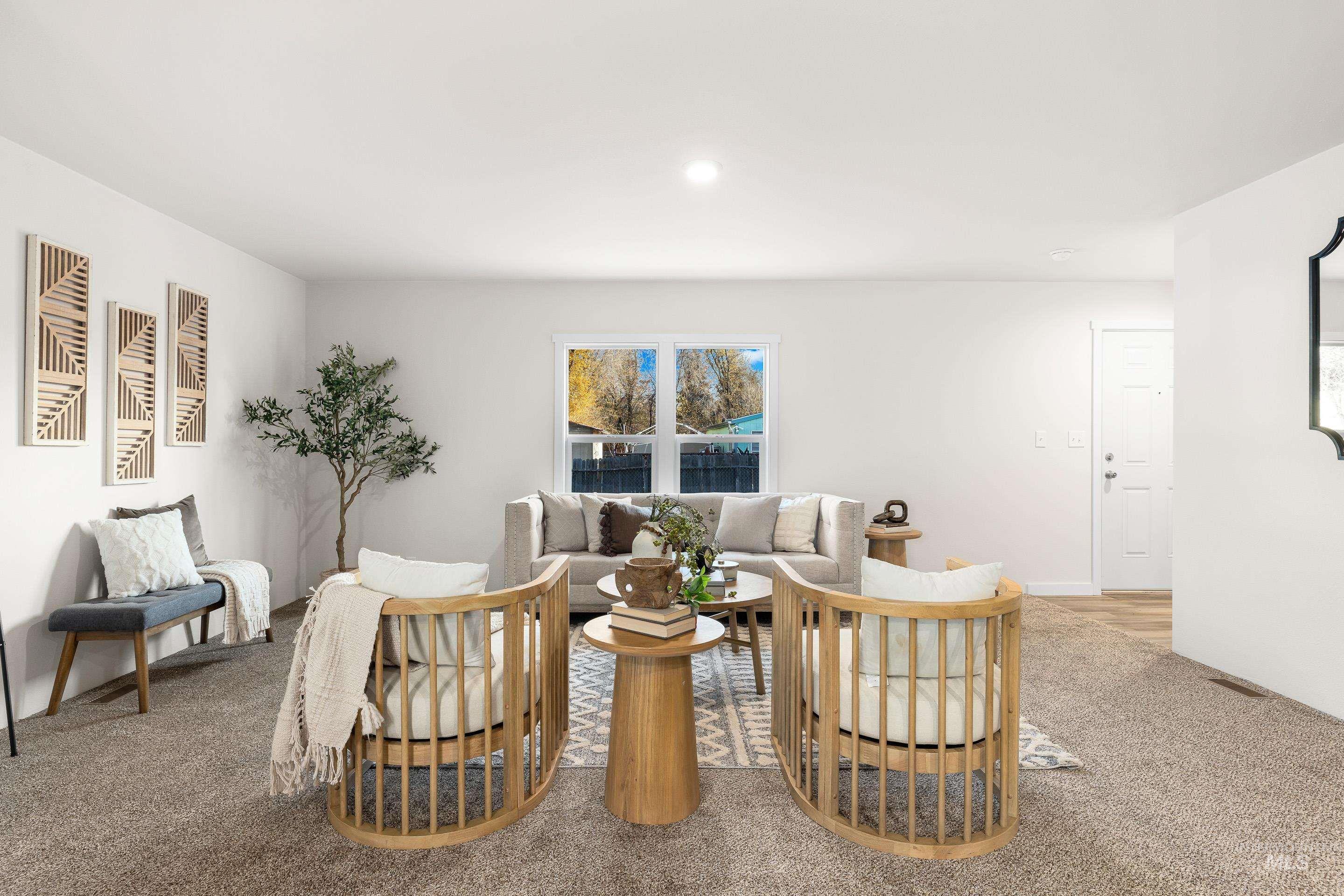 Living area featuring light colored carpet and recessed lighting