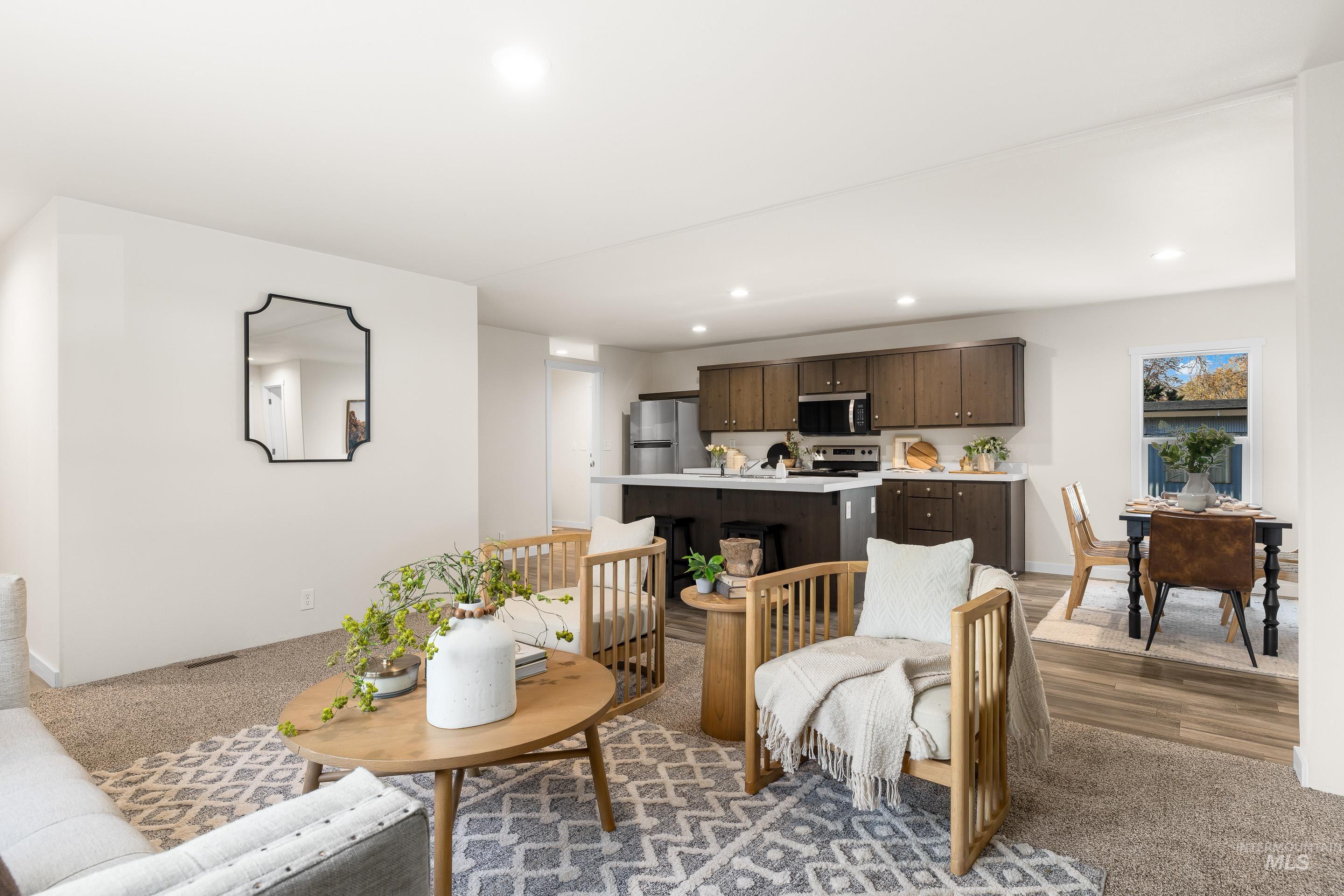 Living room with recessed lighting and light colored carpet