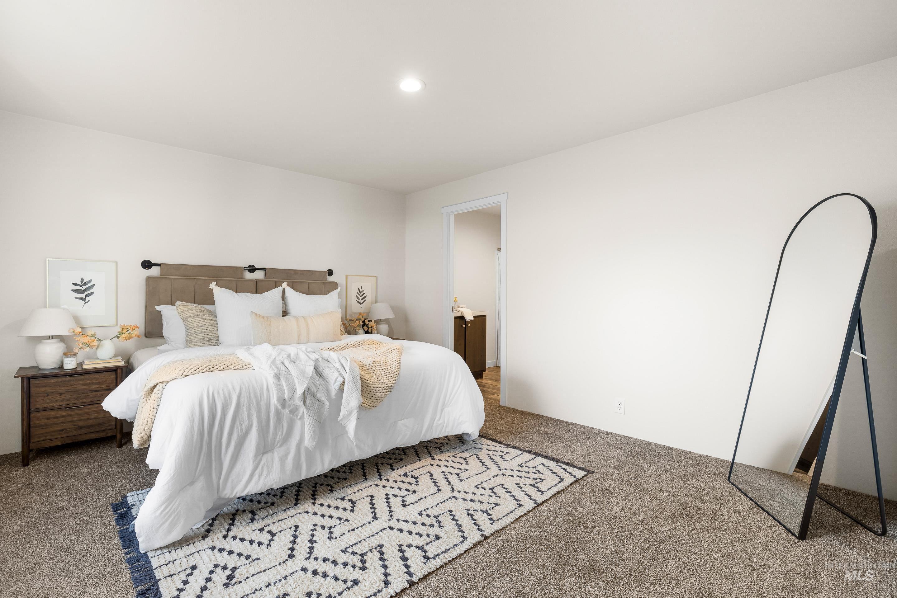 Bedroom with carpet, ensuite bath, and recessed lighting