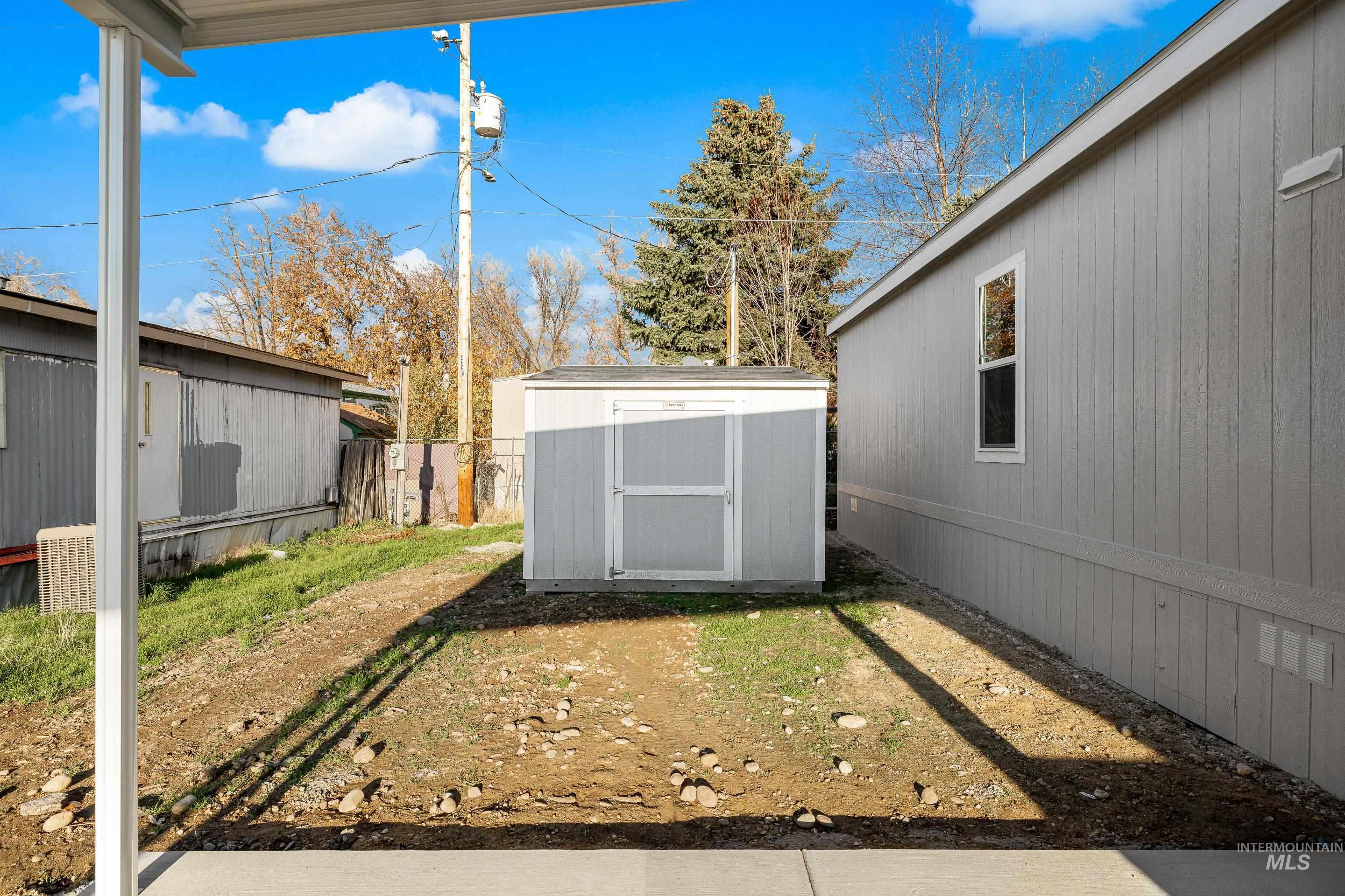 View of yard featuring a storage shed