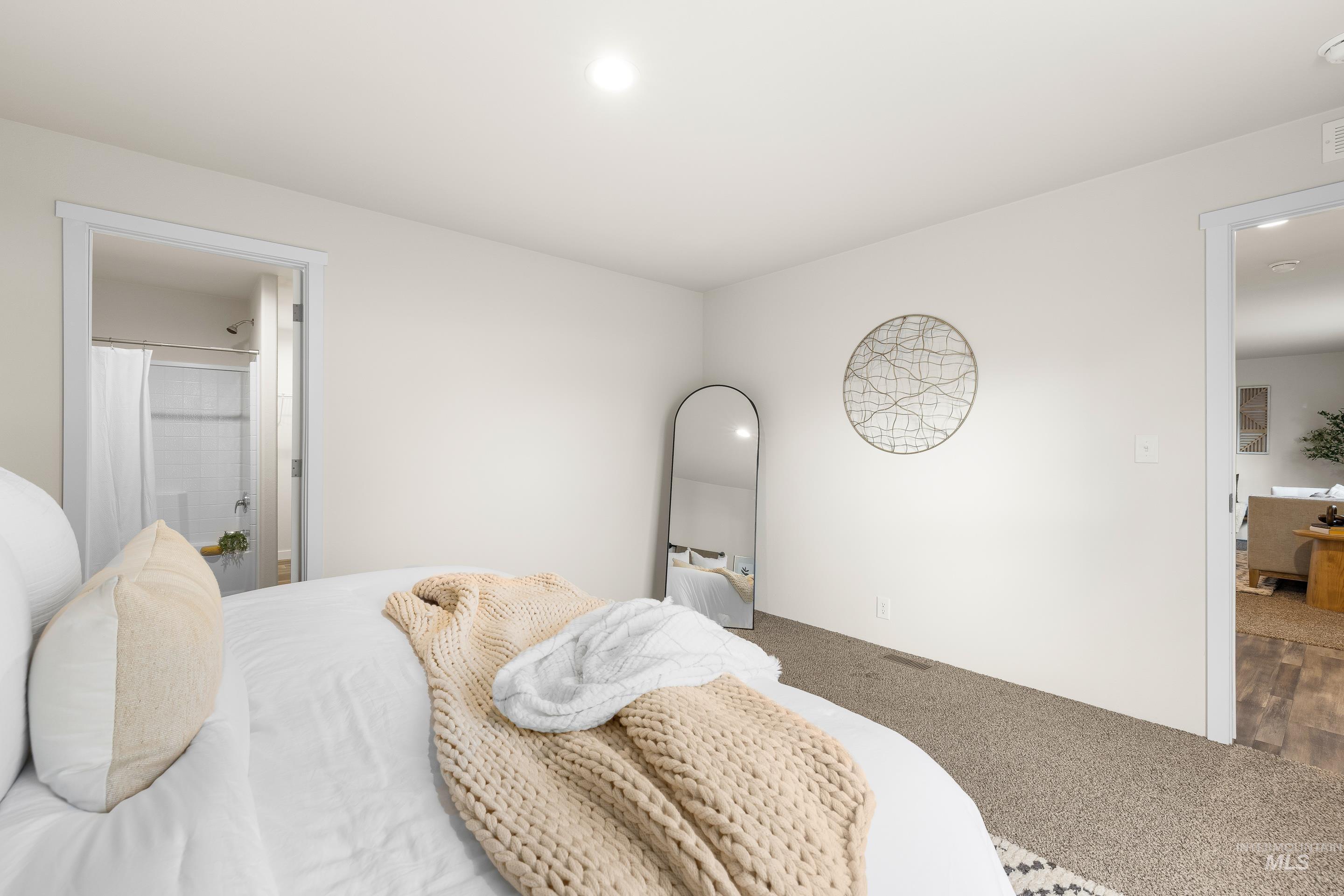 Bedroom featuring carpet flooring, connected bathroom, and recessed lighting