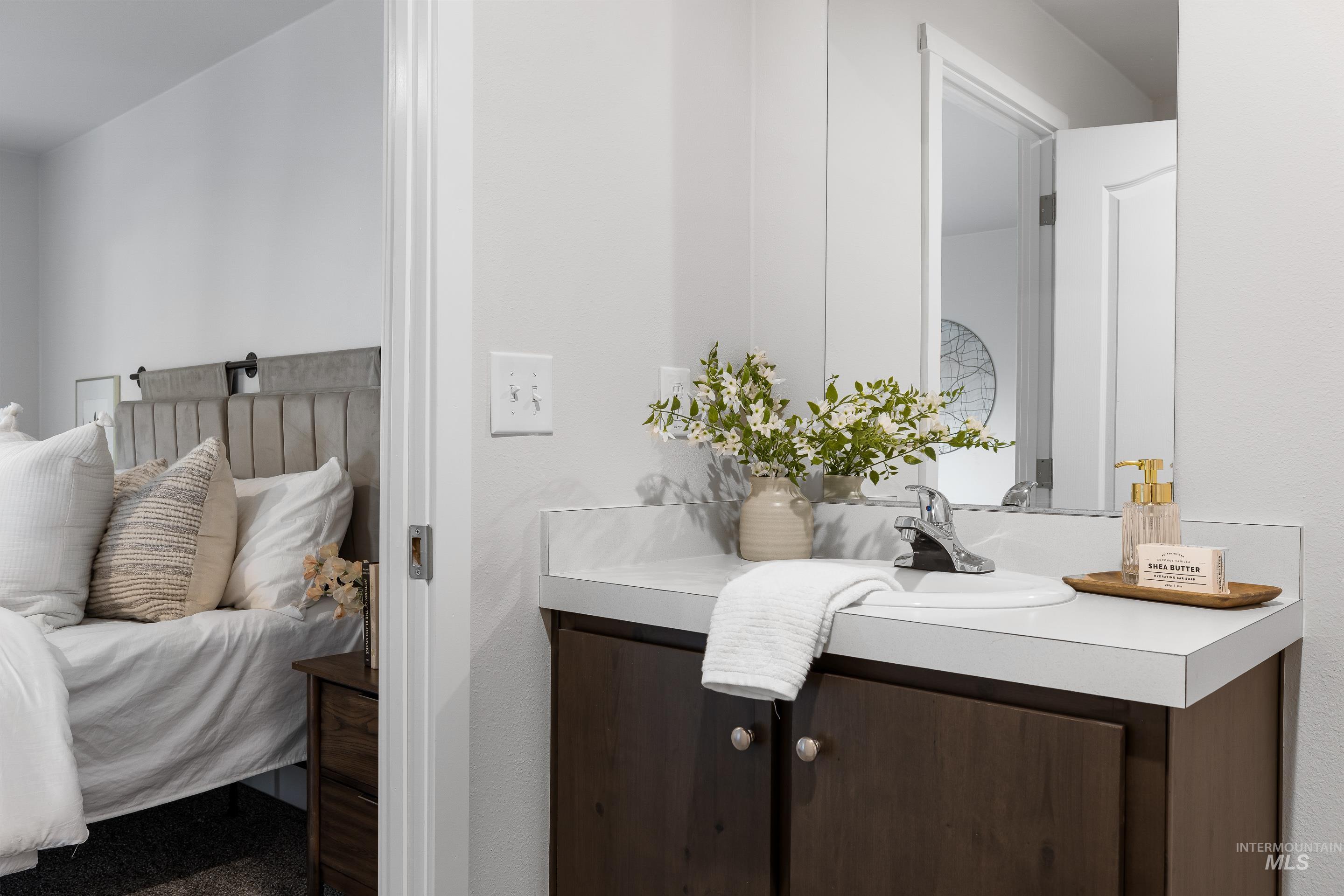 Bathroom with vanity and connected bathroom