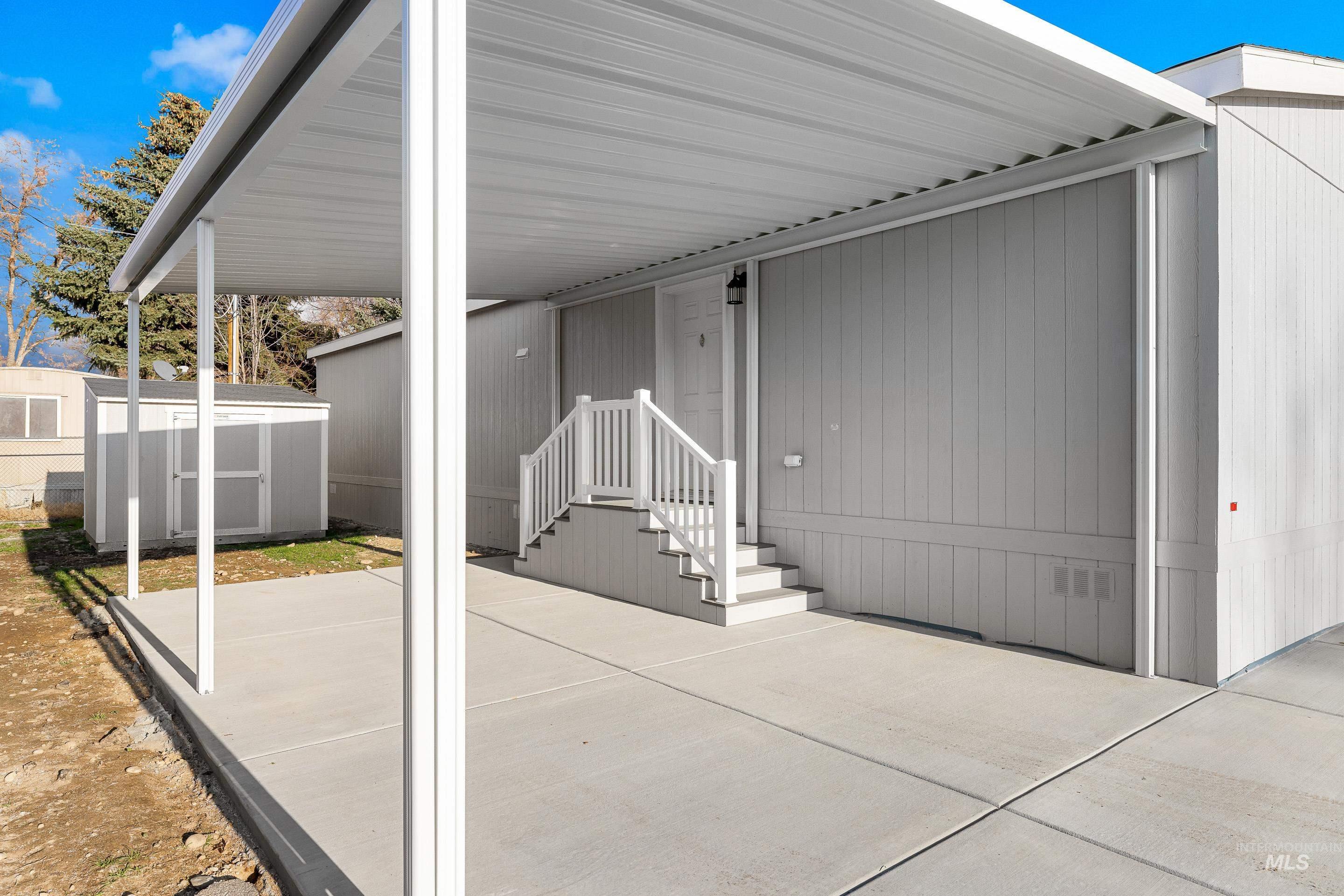 View of patio with a storage unit